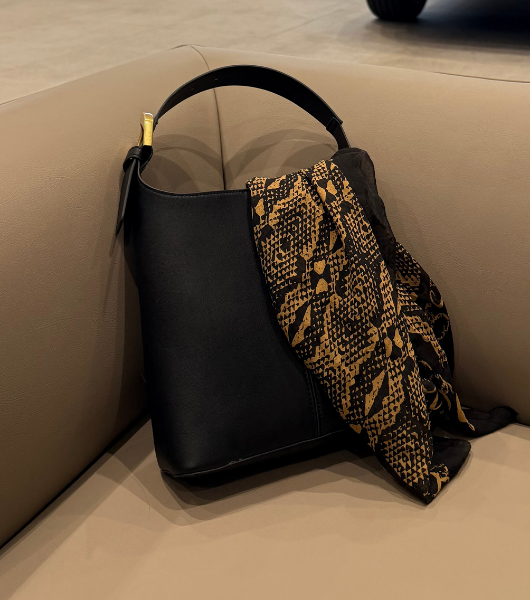 Minimal leather handbag styled for an intentional everyday wardrobe