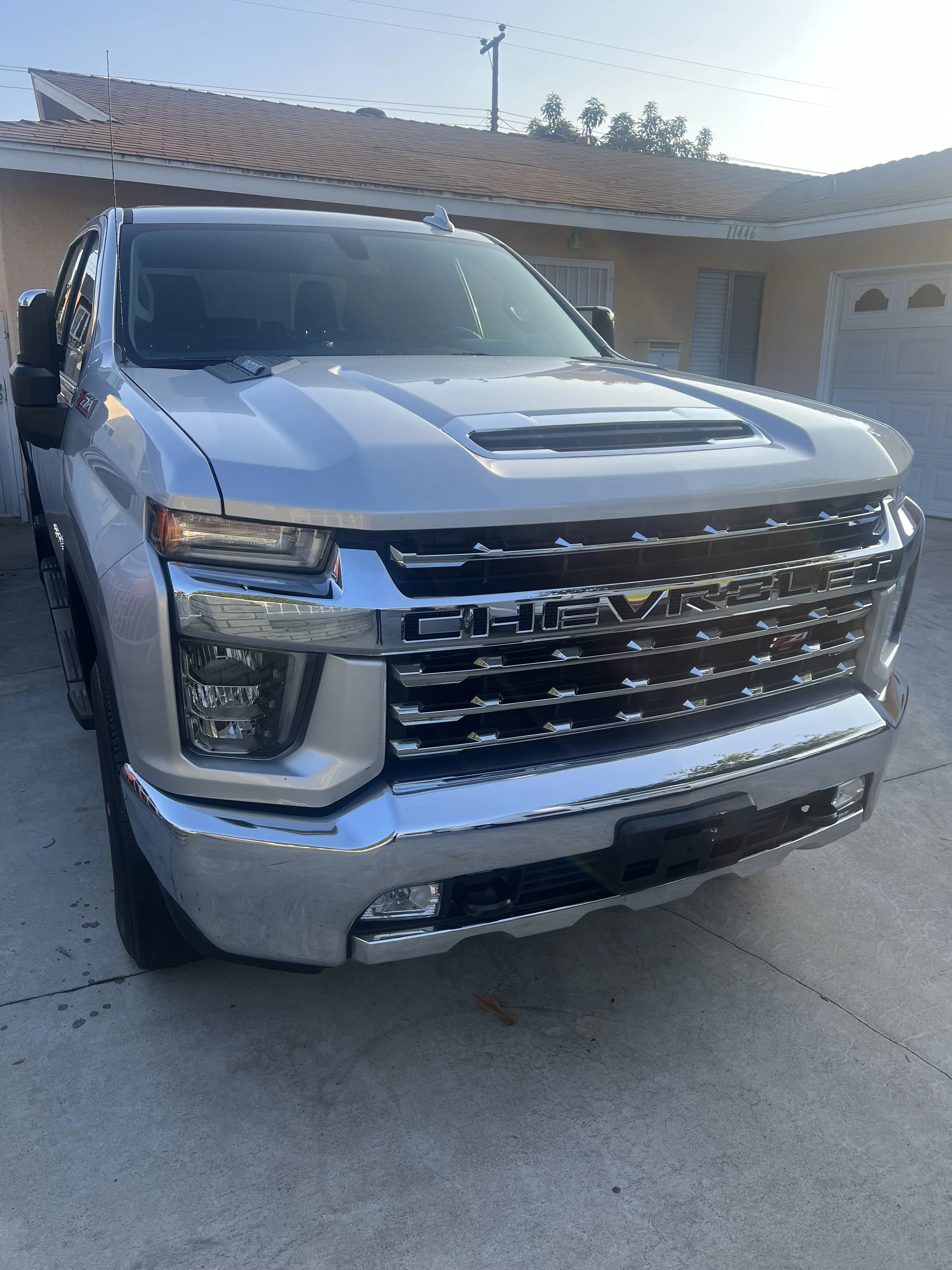 Front view of a silver Chevrolet truck