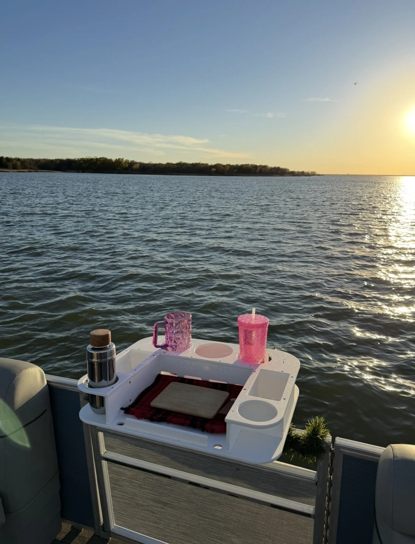 Friends sharing laughs and lake views on a BoatByVal pontoon near Little Elm