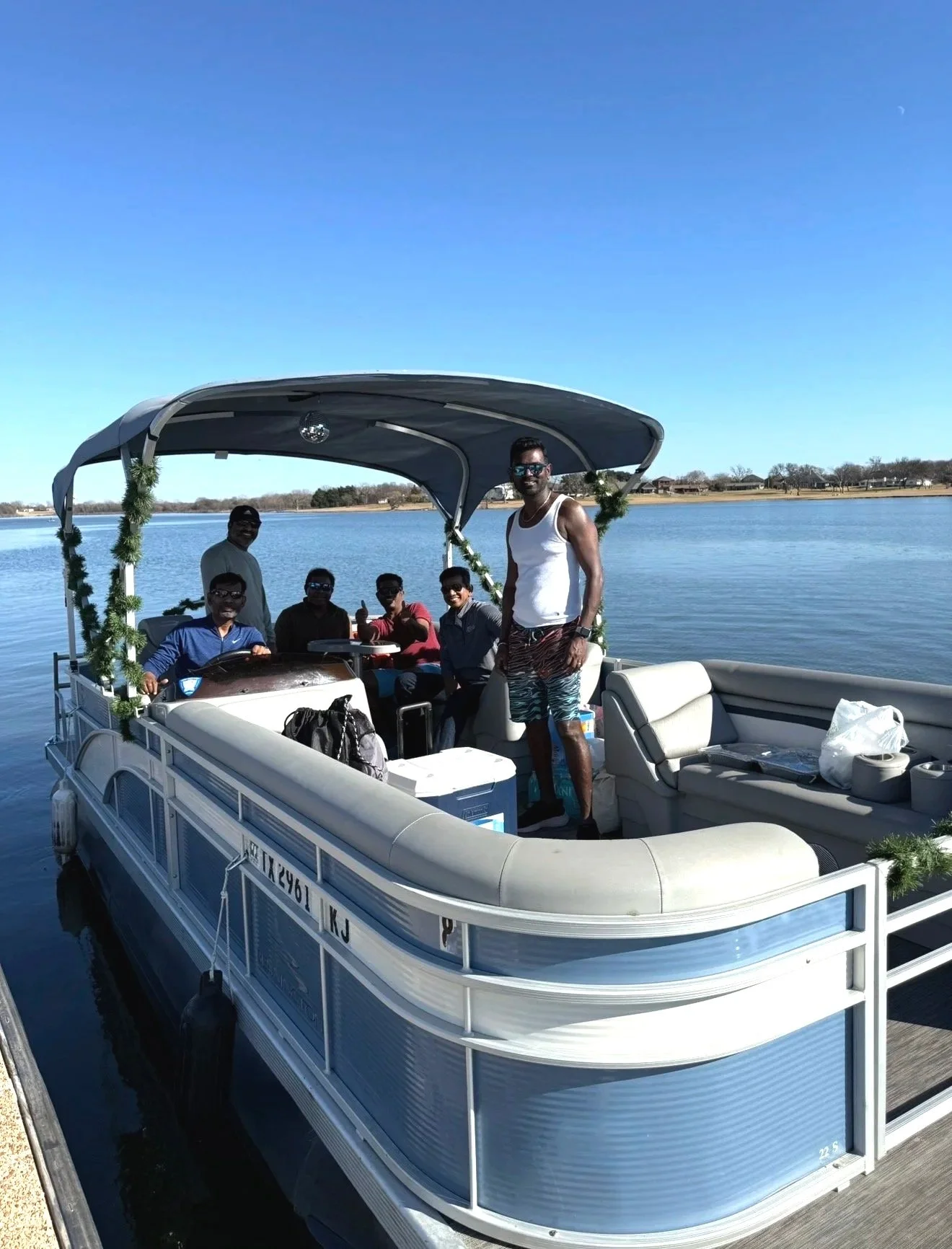 Friends enjoying music and conversation on a BoatByVal pontoon boat on Lake Lewisville