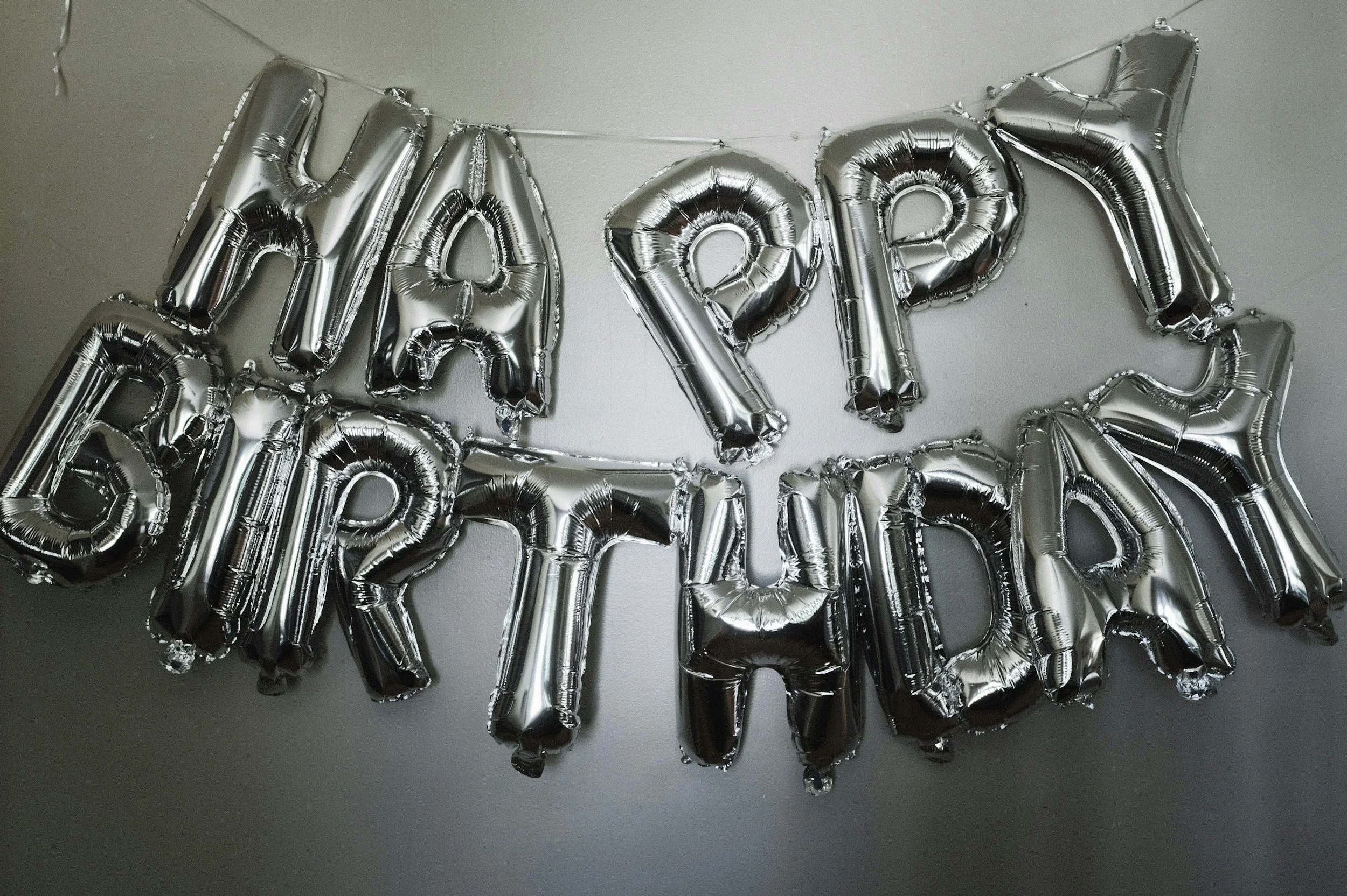 Custom Happy Birthday banner displayed on a Bennington pontoon boat