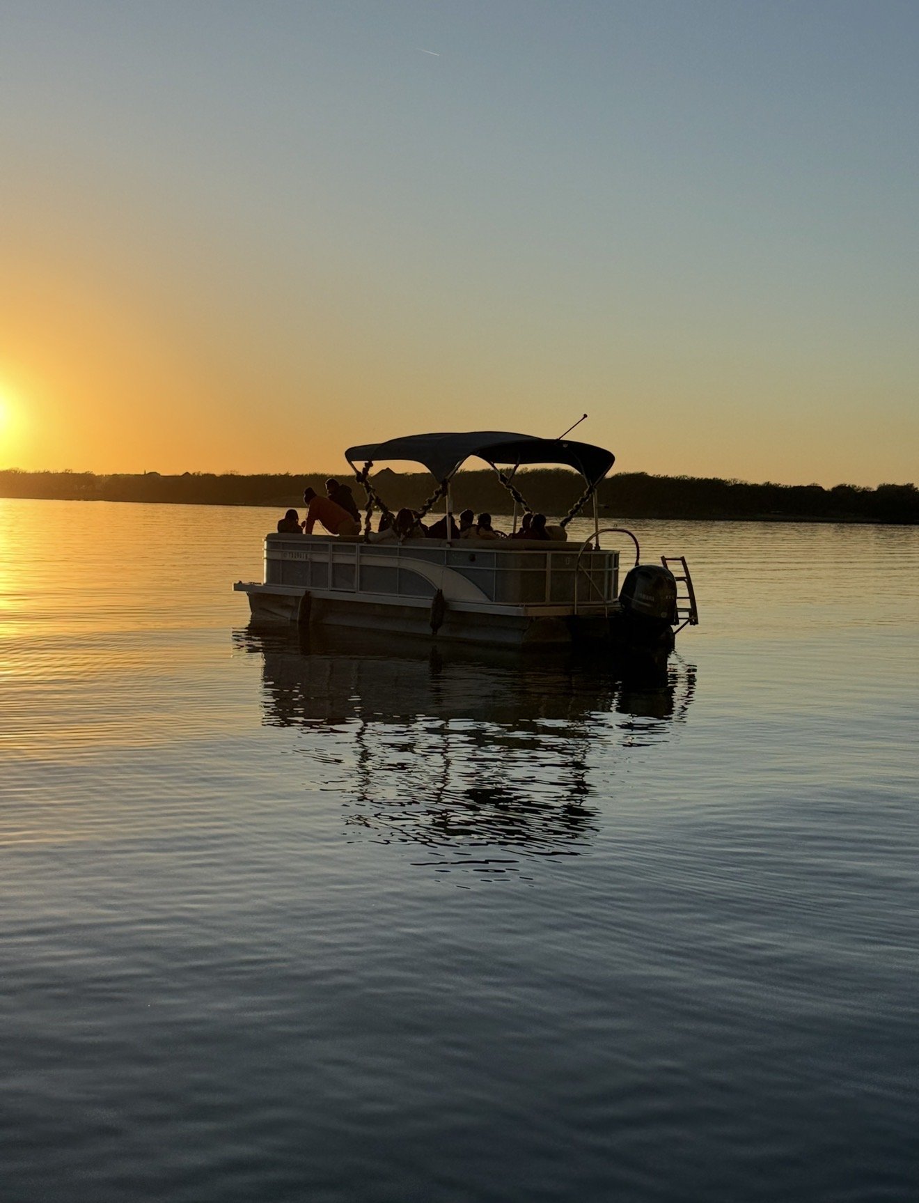Small group of friends enjoying scenic lake views on a BoatByVal pontoon near Frisco