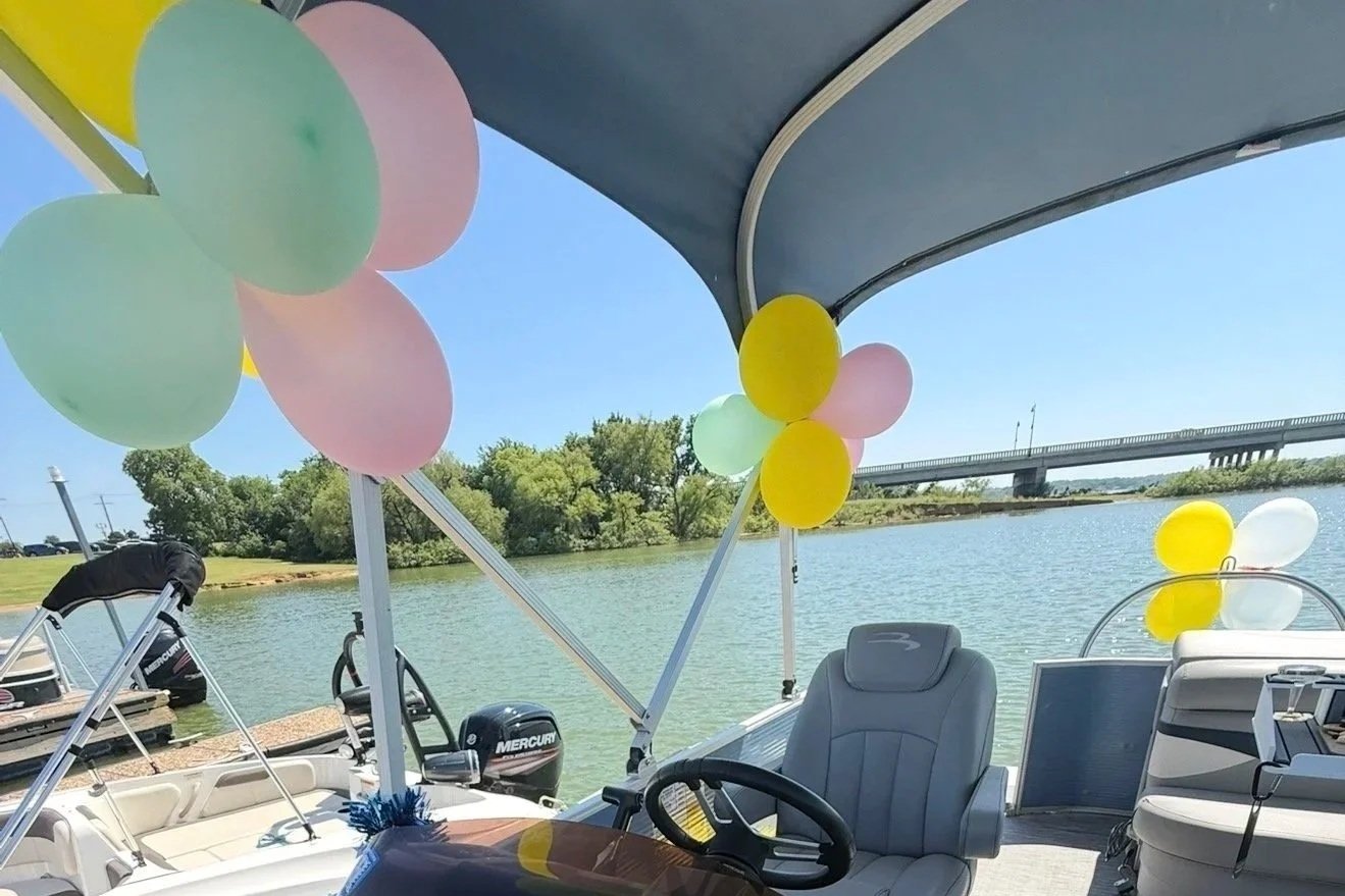 Birthday balloon decorations setup on a Lake Lewisville party boat rental