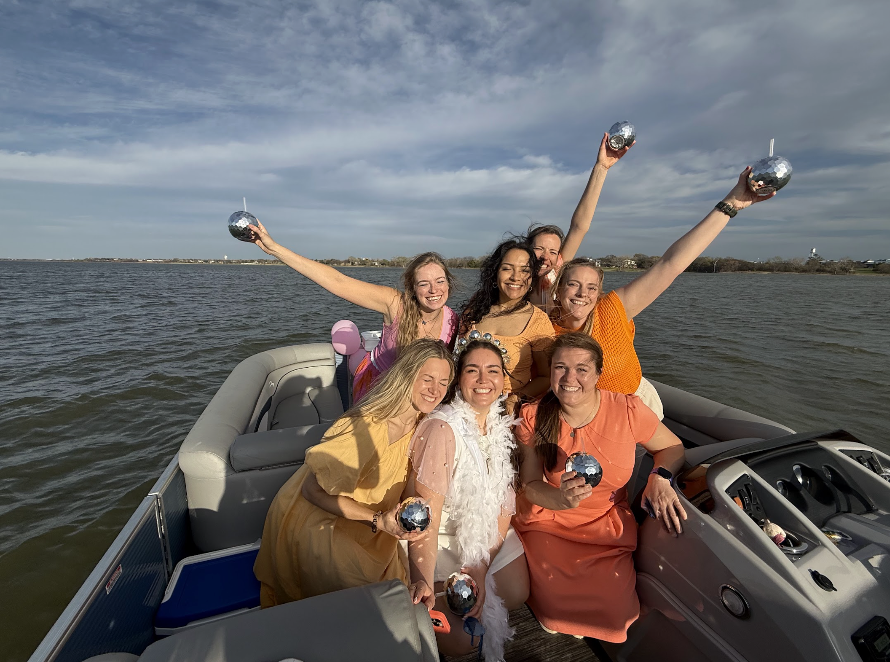 Lake Lewisville bachelorette boat experience with decorated pontoon and group celebration