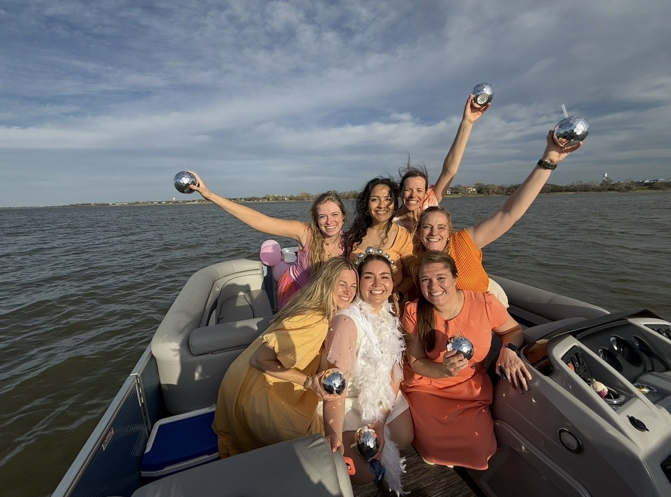 Pontoon boat rental for a bachelorette party on Lake Lewisville near Dallas–Fort Worth with champagne setup, decorations, and karaoke experience by BoatByVal.