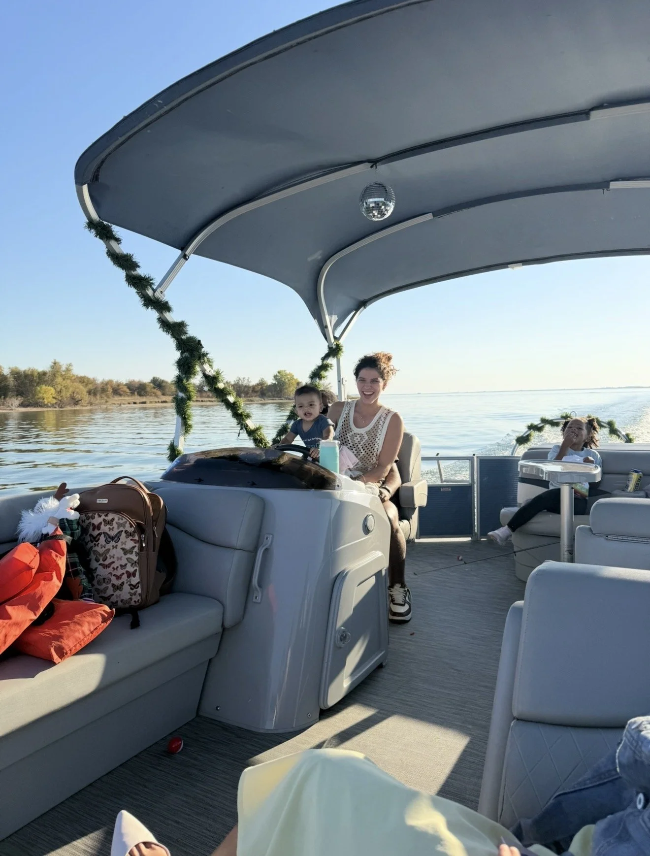 Family group enjoying time together on a BoatByVal pontoon boat on Lake Lewisville