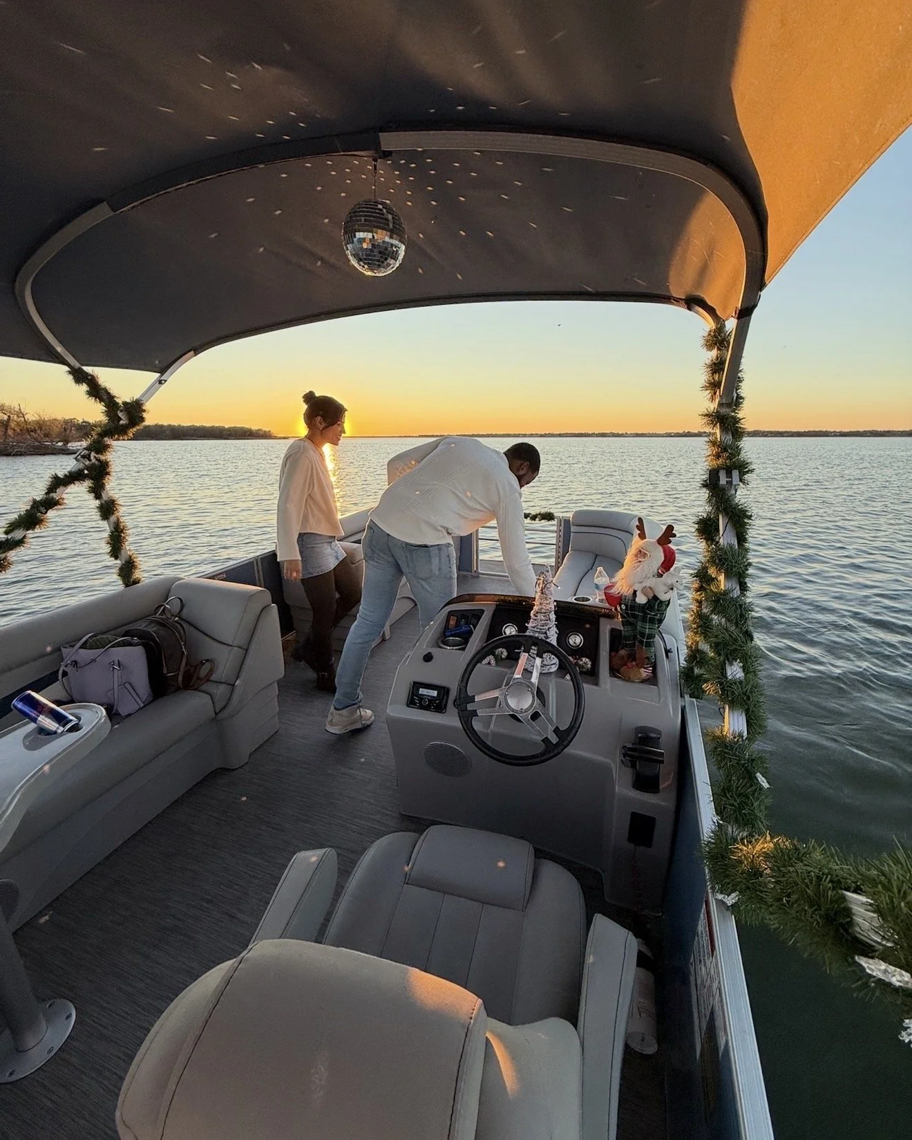 Family group enjoying time together on a BoatByVal pontoon boat on Lake Lewisville