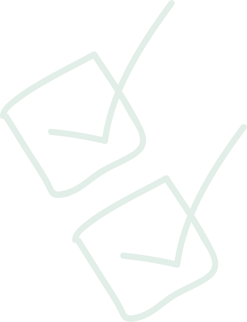 Neon sign of two cocktail glasses with straws and slices of fruit on a black background.