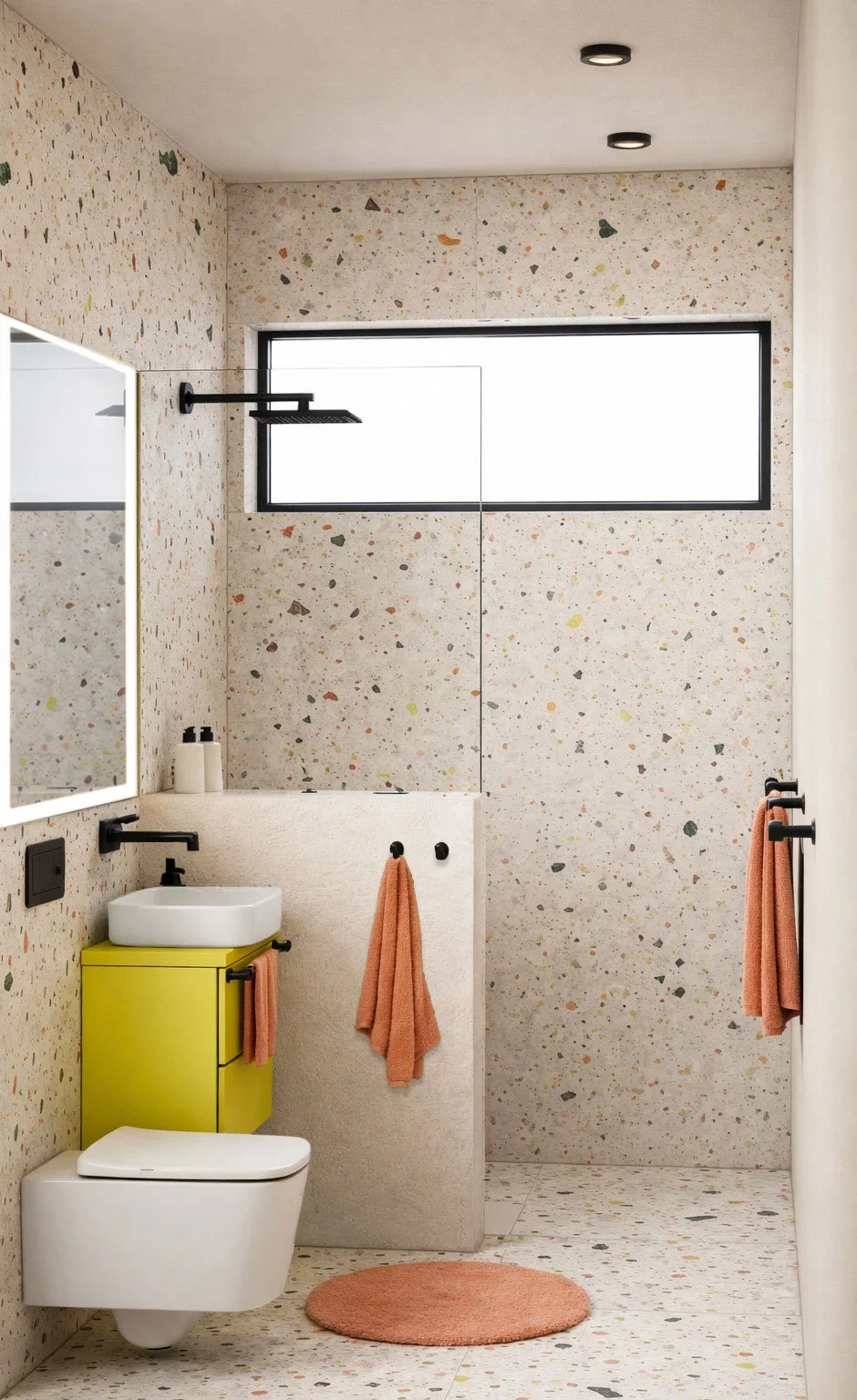 Modernes Badezimmer von modoru mit bunten schadstofffreien Terrazzo-Fliesen, Lehmputz, Waschtischunterschrank, schwarzen Armaturen + durchdachter Beleuchtung – nachhaltiges Interior Design, Baubiologie, ökologische Materialien + gesundes Raumklima