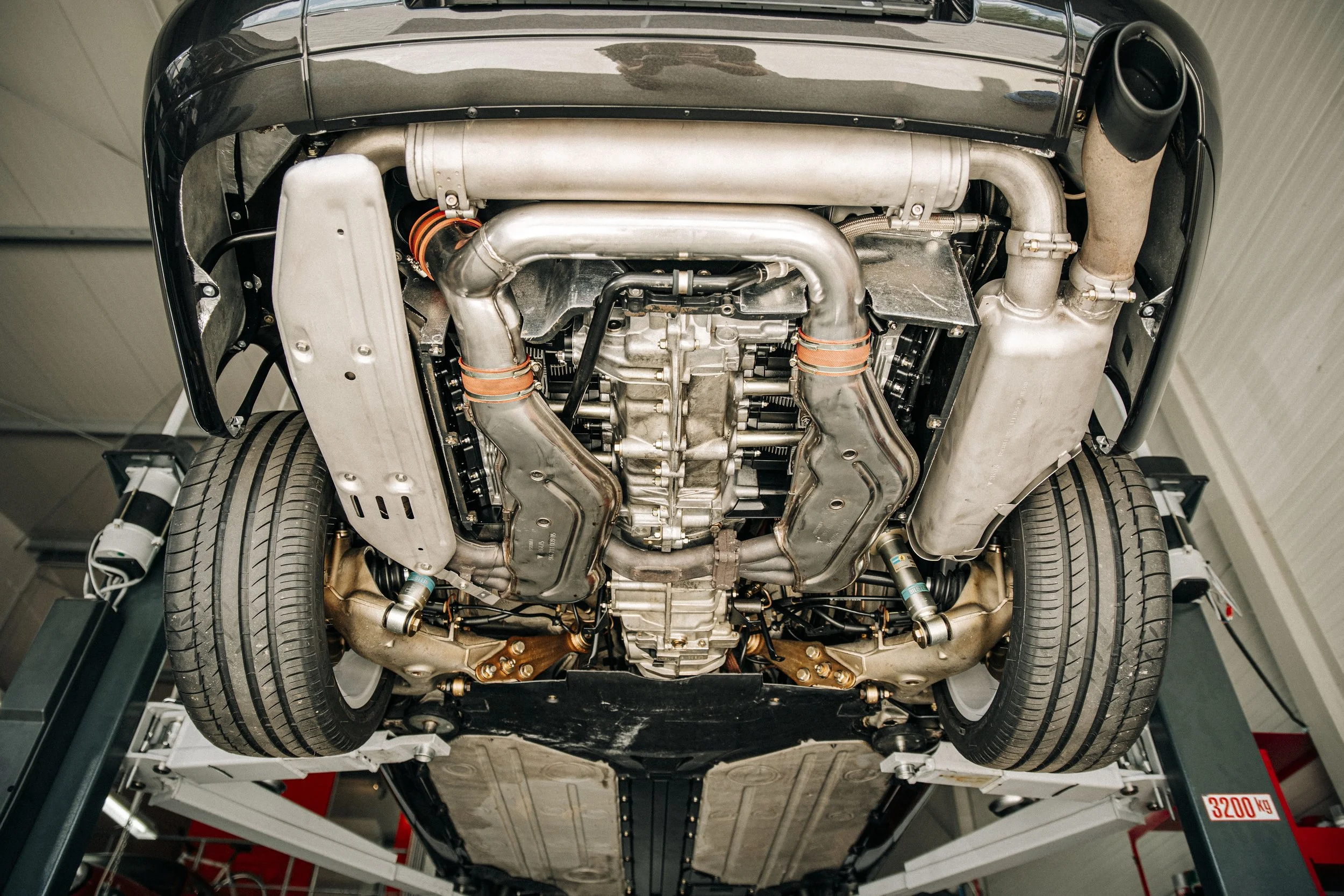 Delivery-ready rear end underbody, with factory wax applied for corrosion protection.