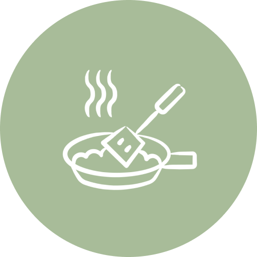 Illustration of a frying pan with steam rising and a spatula stirring food inside.