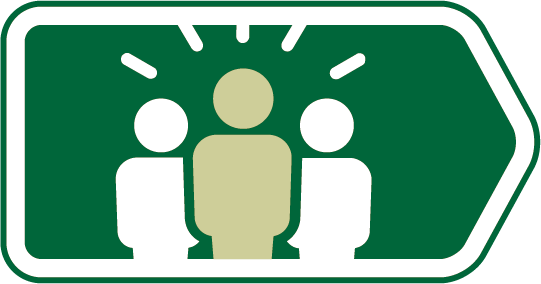 A green direction sign with three stylized human figures in the center, indicating guidance or instruction.