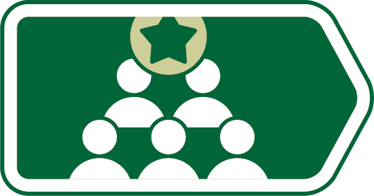 Green directional sign with a white diagram of six people connected in a pyramid arrangement and a star symbol at the top.
