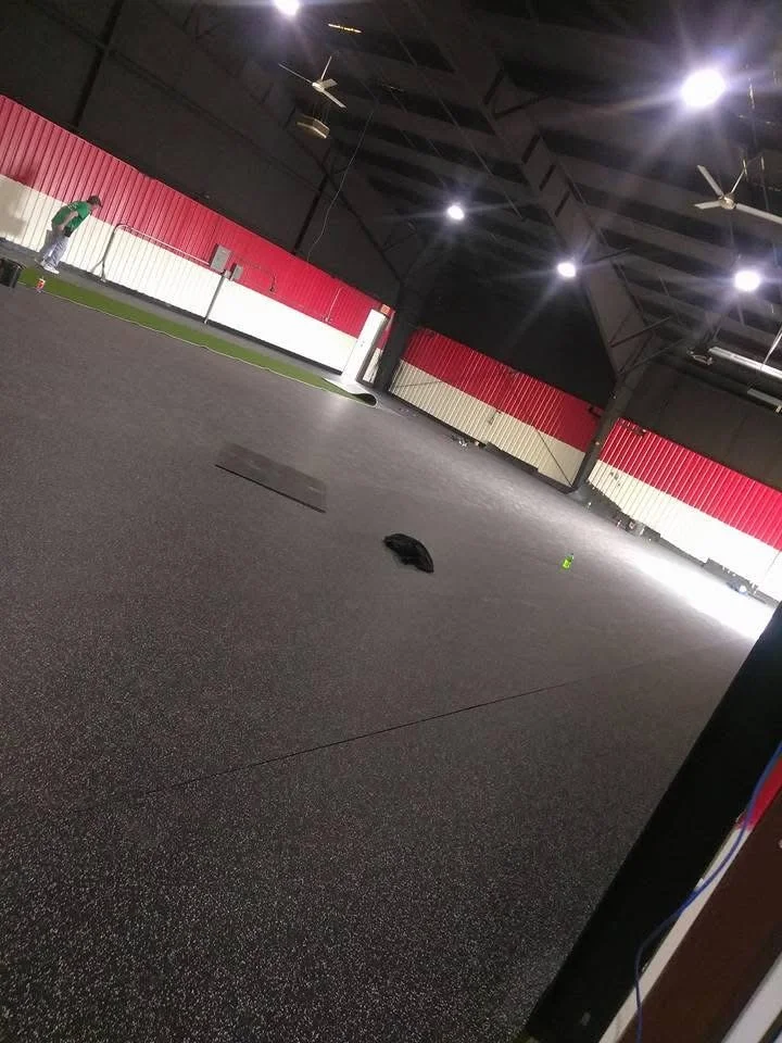 Shock-absorbing rubber installed in a fitness center for added comfort and noise reduction.