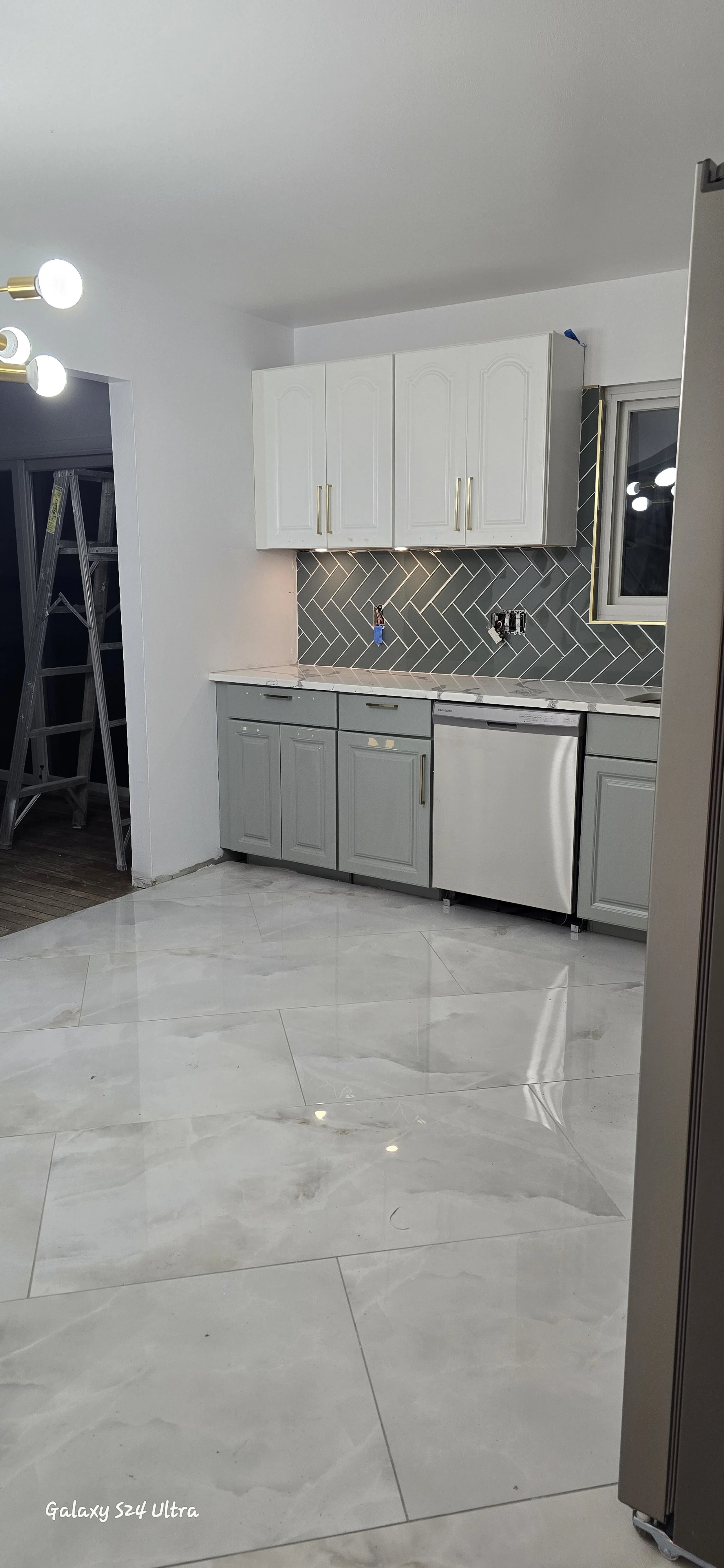 Kitchen tile installation featuring straight lines and a durable surface. St. Louis home after 2