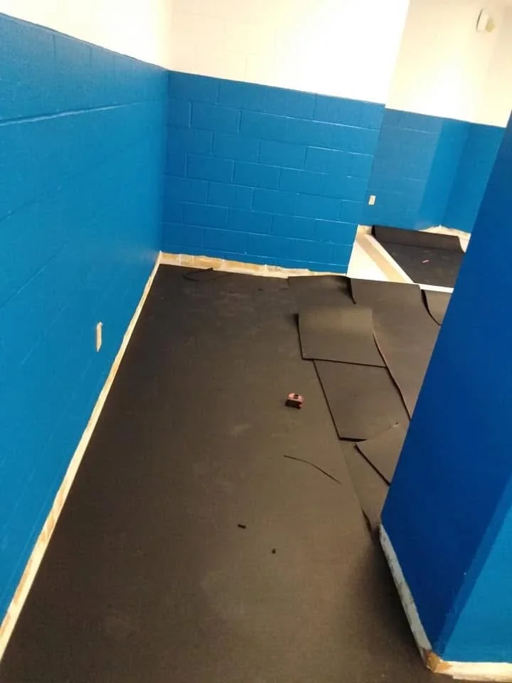 Commercial rubber flooring laid with precise alignment for a safe, high traffic area.