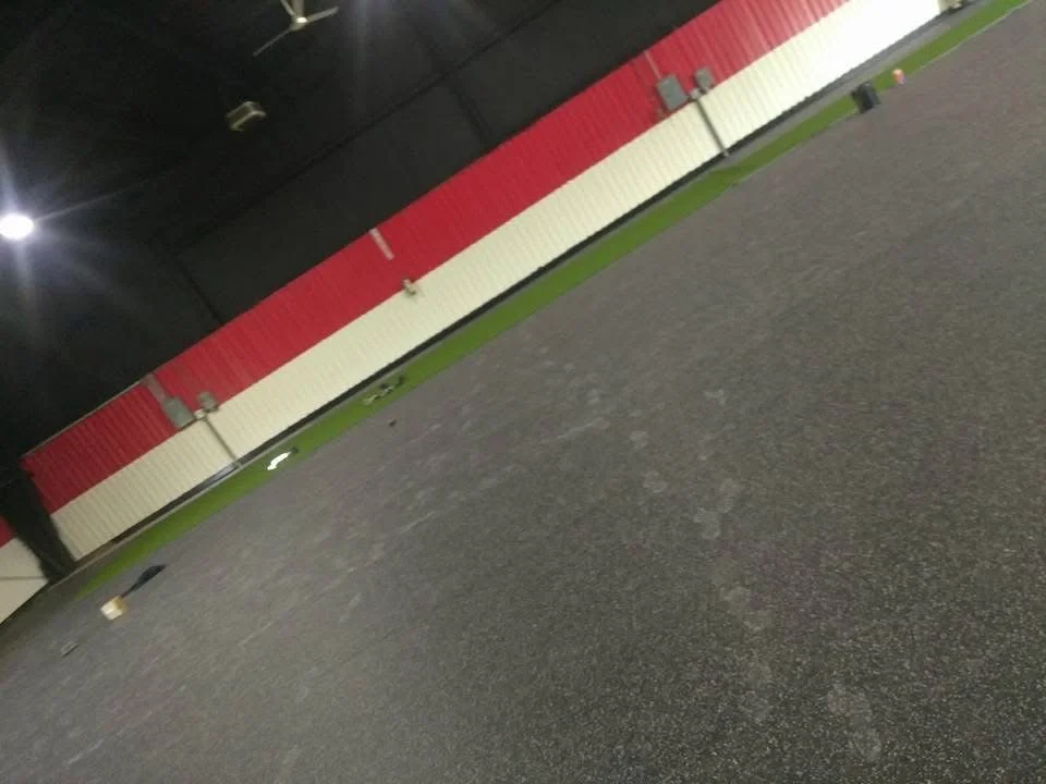 Rubber gym flooring with tight edges and level surface for heavy equipment use. 