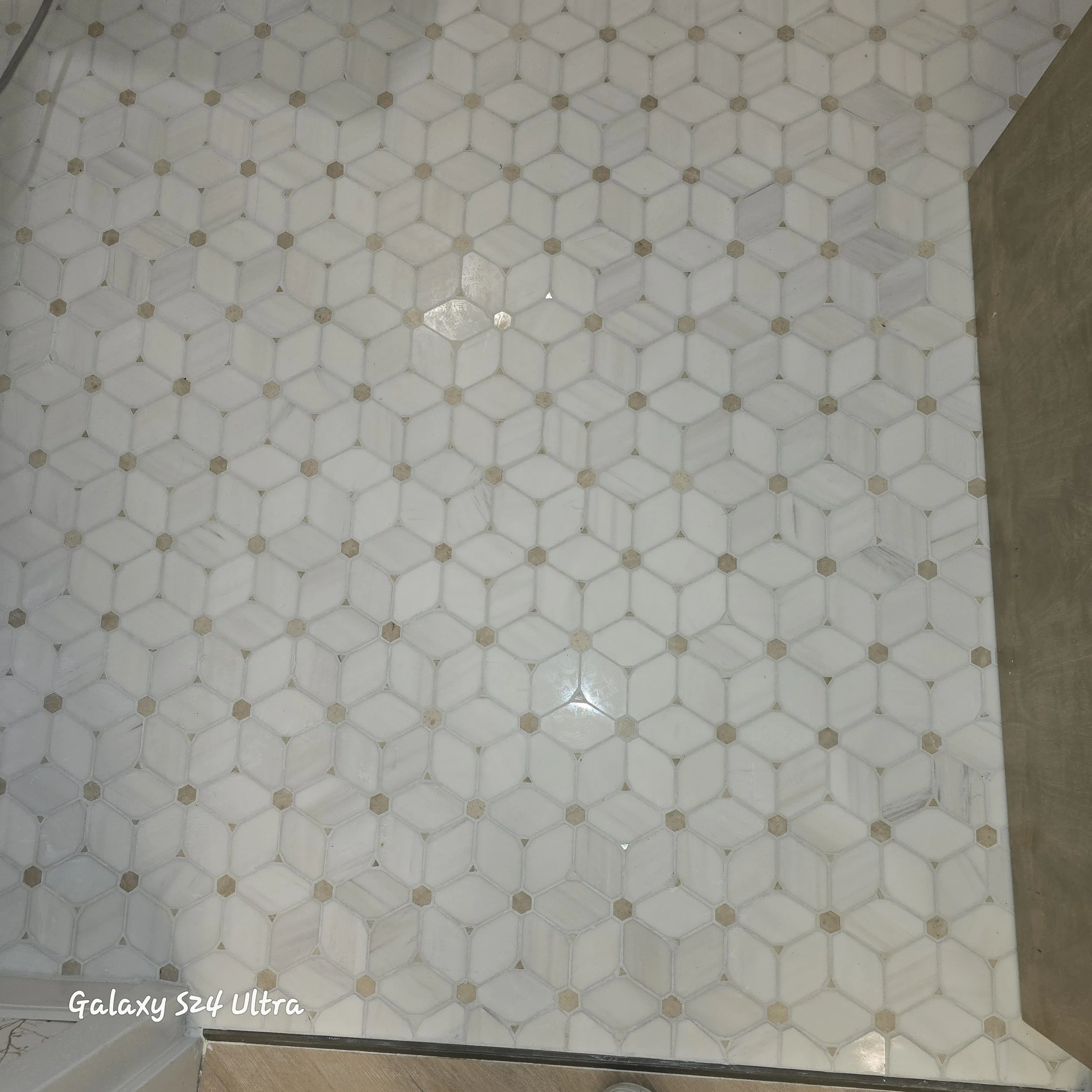 Close up of marble tile installed in a business in Webster Groves. 