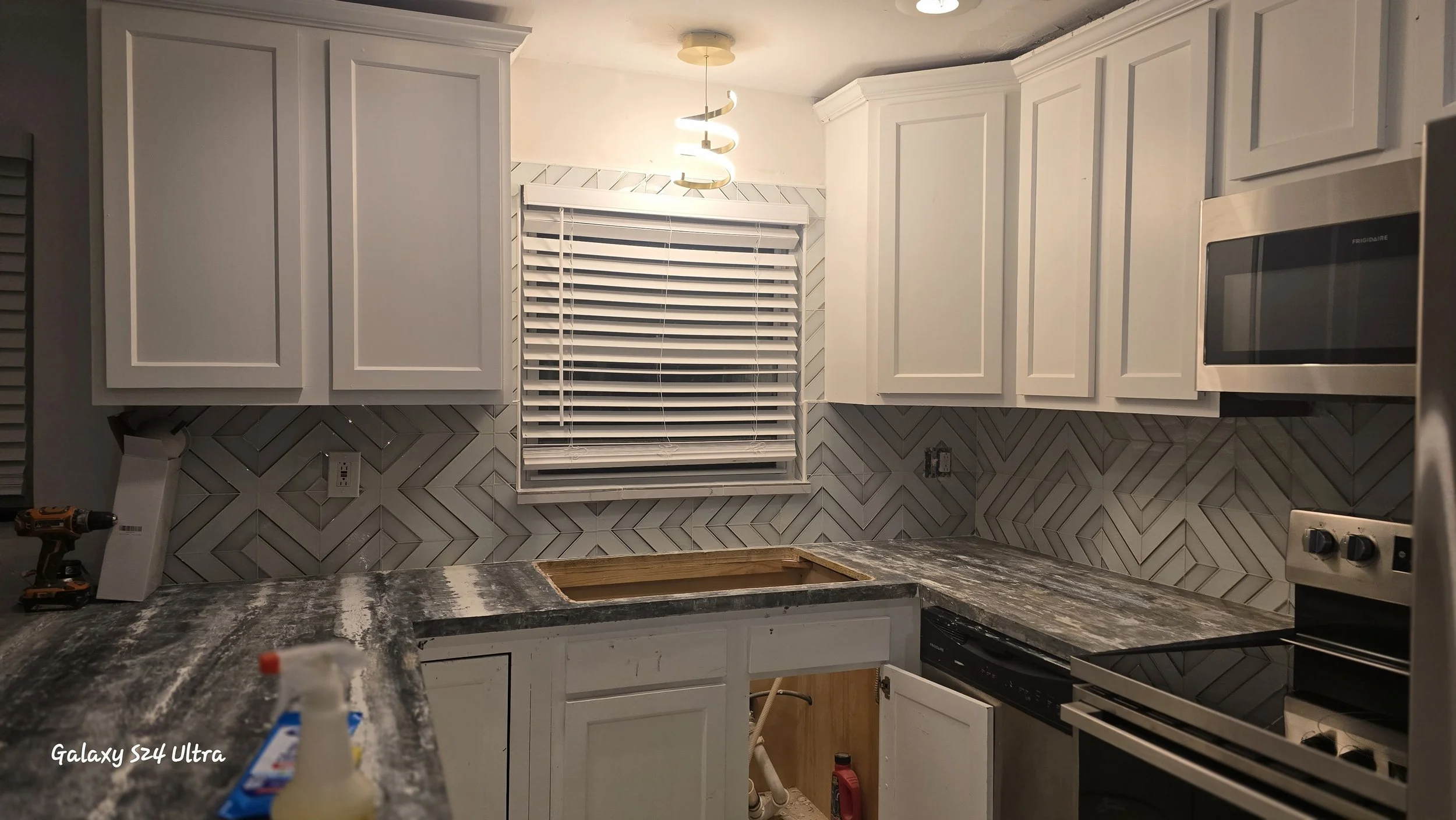 Tile custom backsplash installed with consistent spacing and a clean finish.