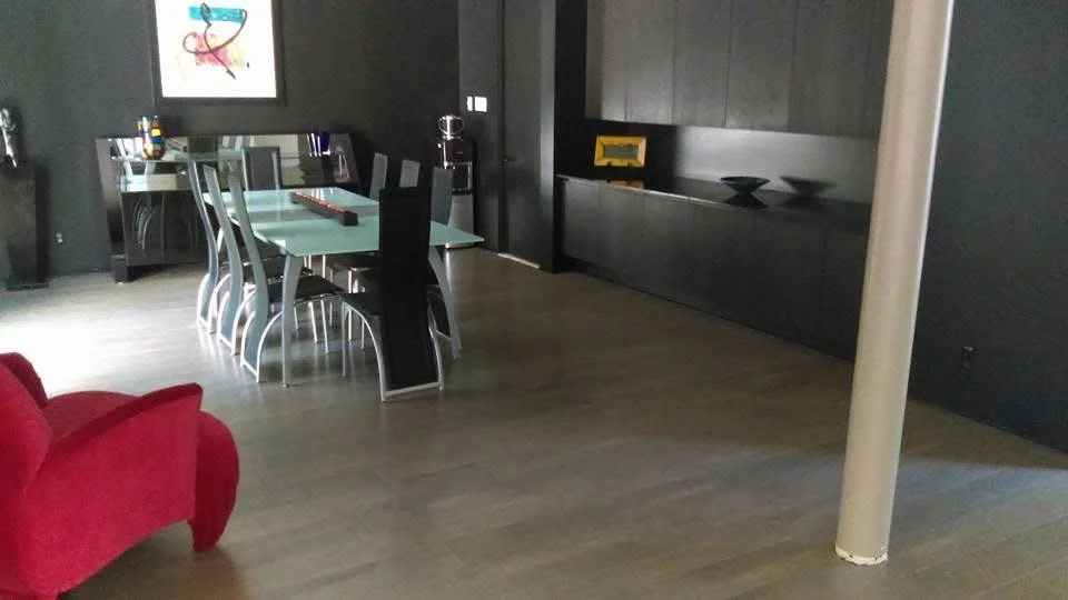 Dining room in a St. Louis home with light-tone hardwood with a uniform layout
