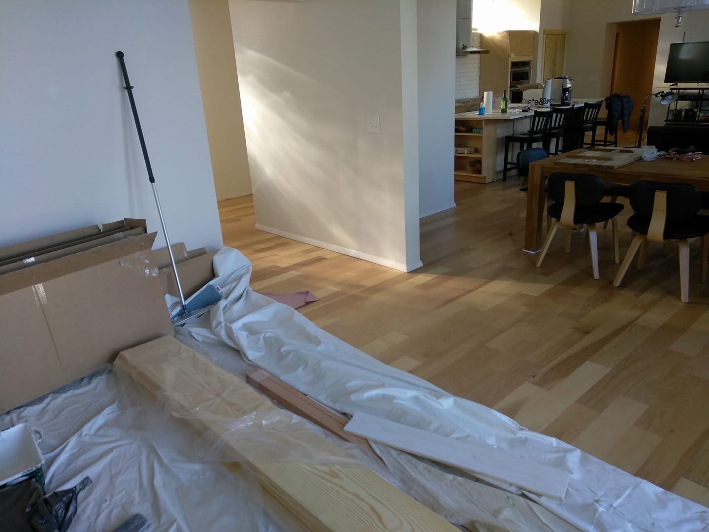 Hardwood installation in multiple rooms with clean look and connecting rooms.