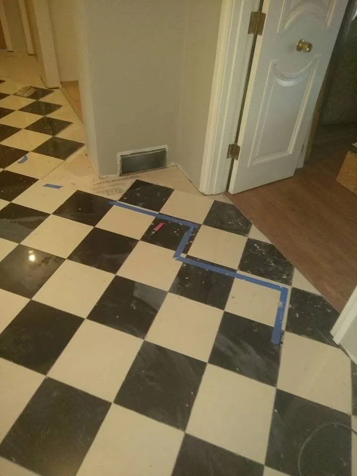 Tile installed with a smooth transition between two rooms.