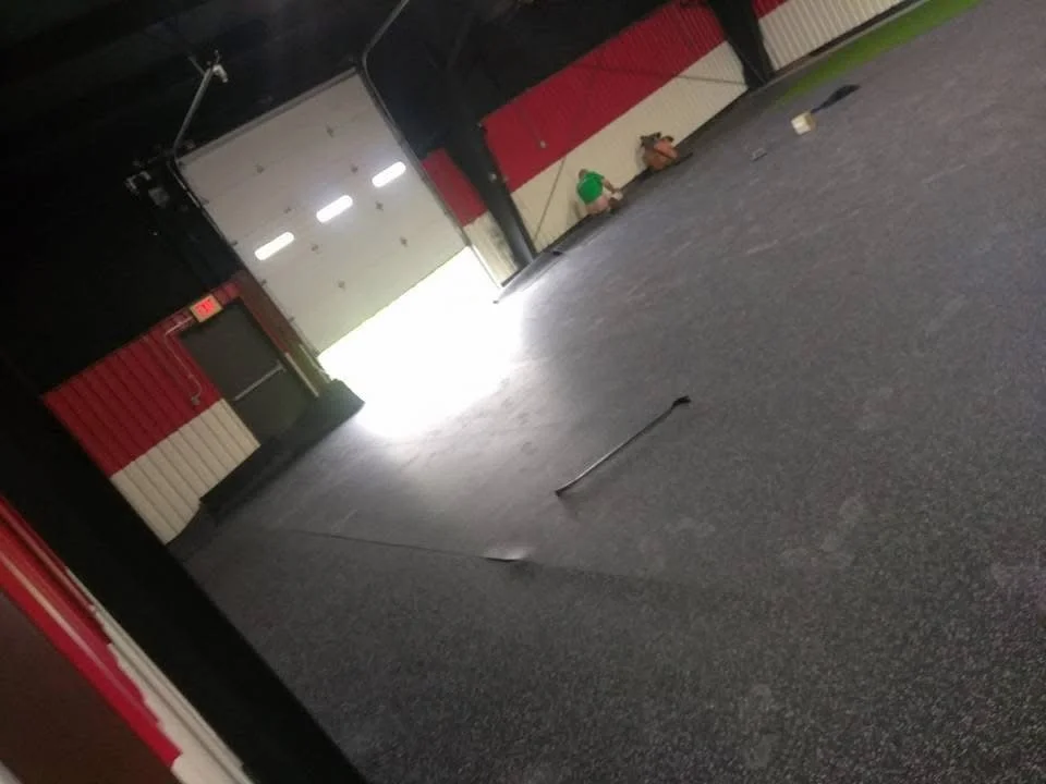 Rubber flooring upgrade in a gym, providing cushioning and impact protection. 