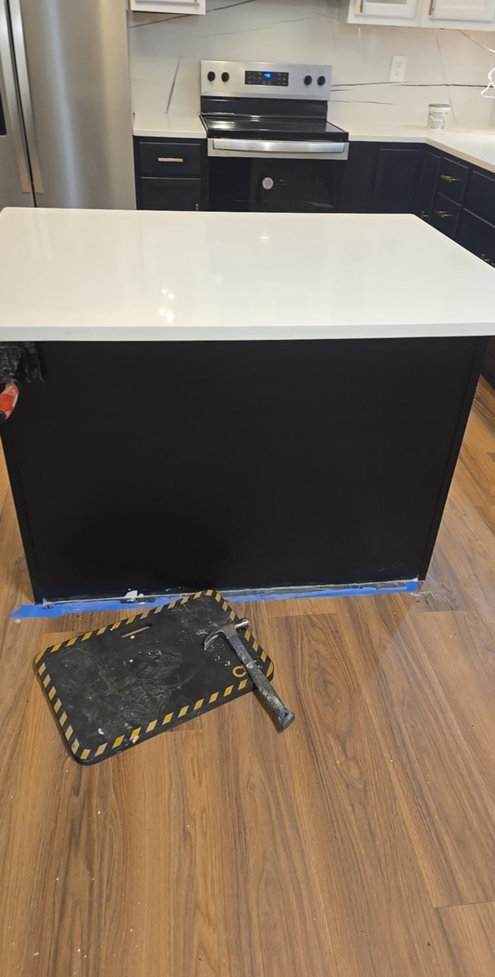 Laminate flooring installed with tight seams and smooth surface, giving the room a fresh updated look.