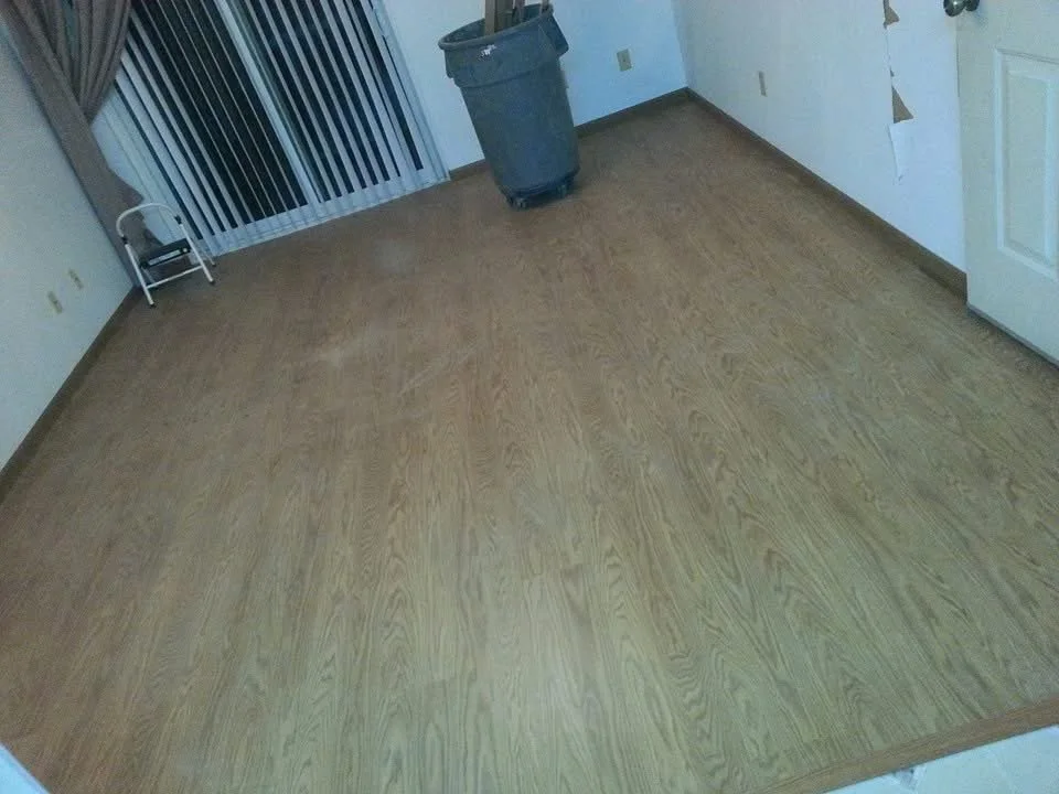 Natural-toned hardwood flooring installed to create a warm, clean look in residential home.