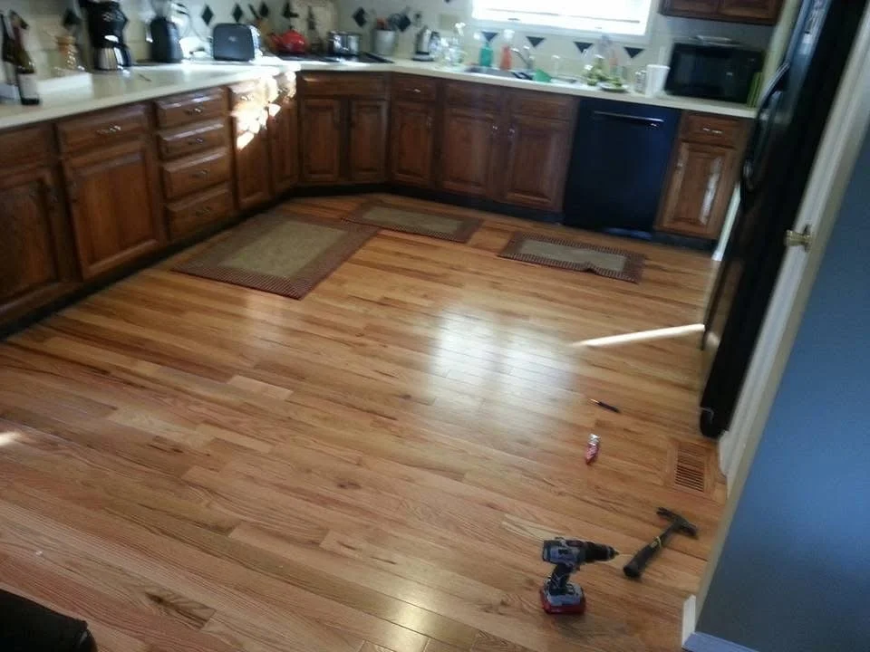 Hardwood installation in a St Louis kitchen with consistent lines and a polished finish. 