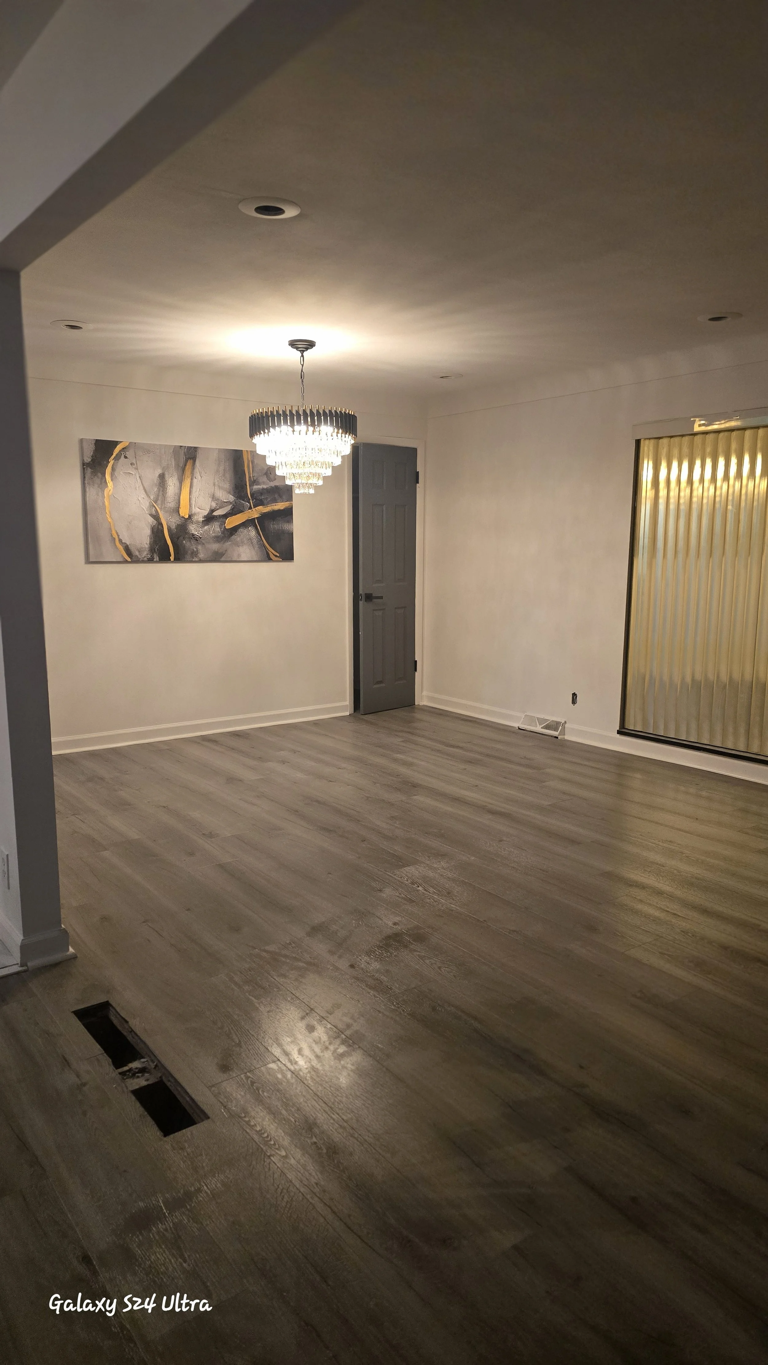 Luxury vinyl plank installed with tight, seamless joints, creating a clean and modern look throughout the space.