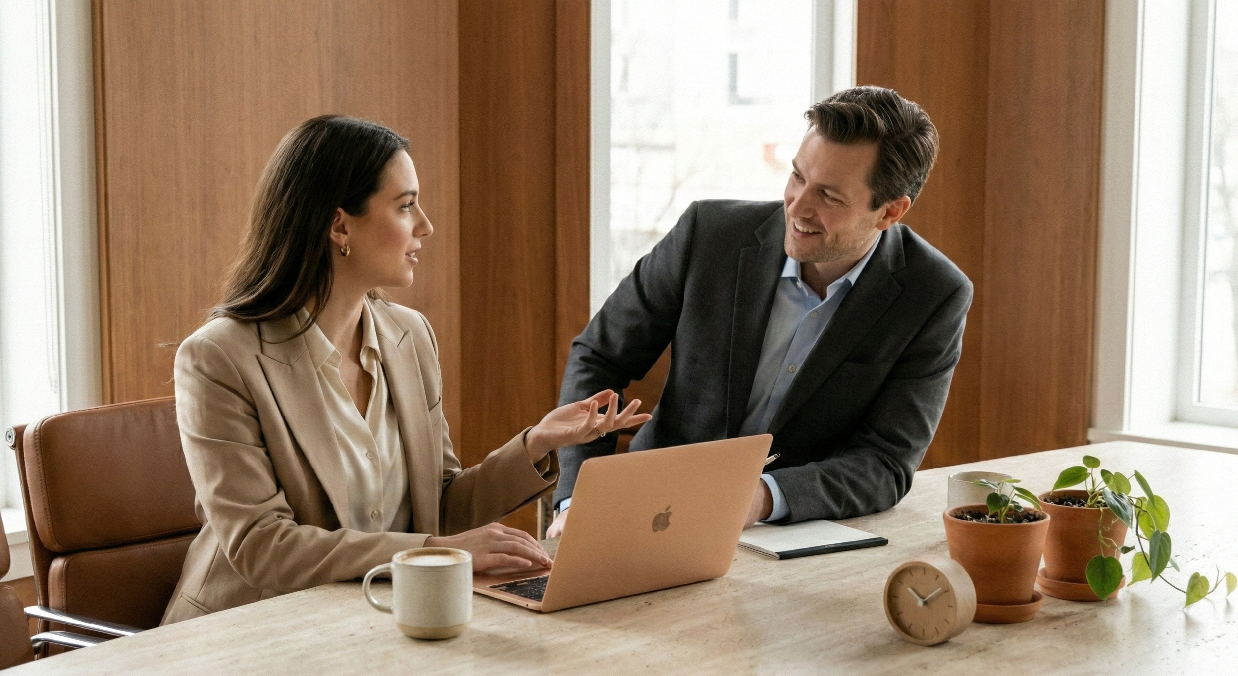 One-on-one executive assistant coaching conversation at a conference table