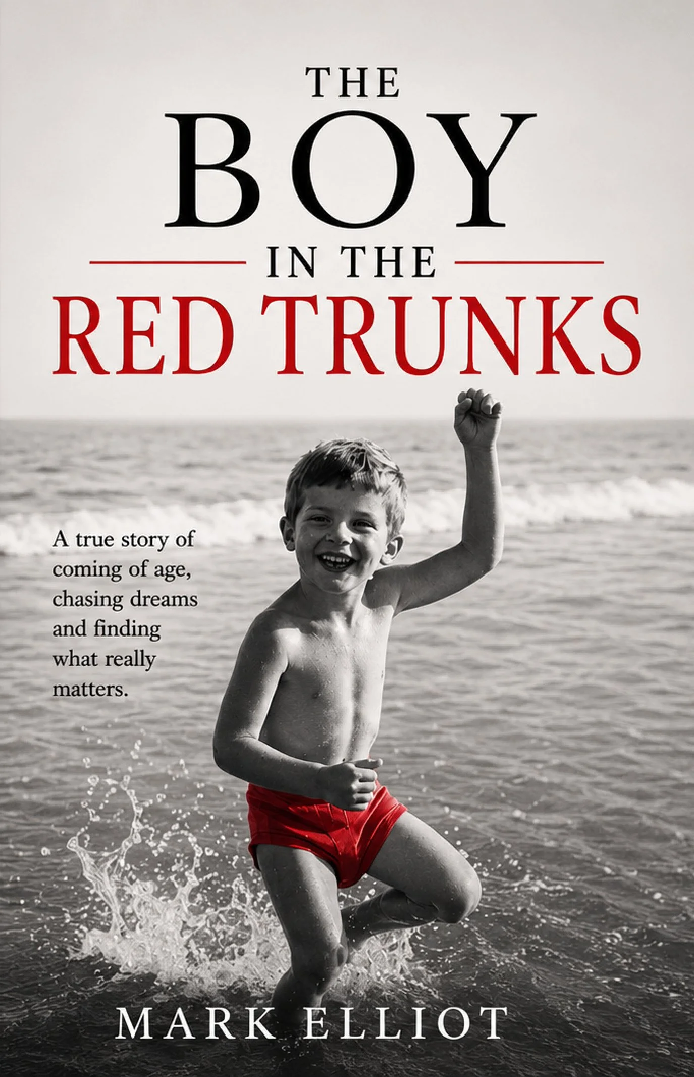 Book cover titled 'The Boy in the Red Trunks' by Mark Elliott, showing a black and white photo of a smiling boy in red trunks splashing in the ocean.