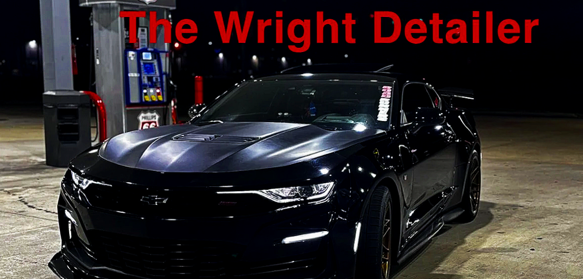 A black custom Chevrolet Camaro sports car at a gas station at night with the text 'The Wright Detailer' in red at the top.