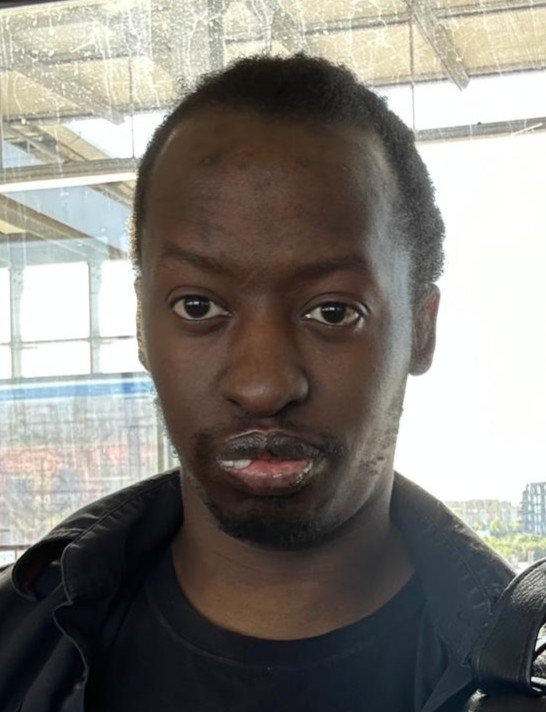 A man with a serious expression