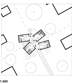 Architectural site plan with multiple small building structures connected by walkways and surrounded by trees.