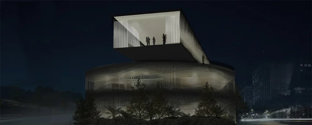 Night view of a modern, multi-level building with a perforated metal facade and an elevated glass-walled viewing area with people inside.