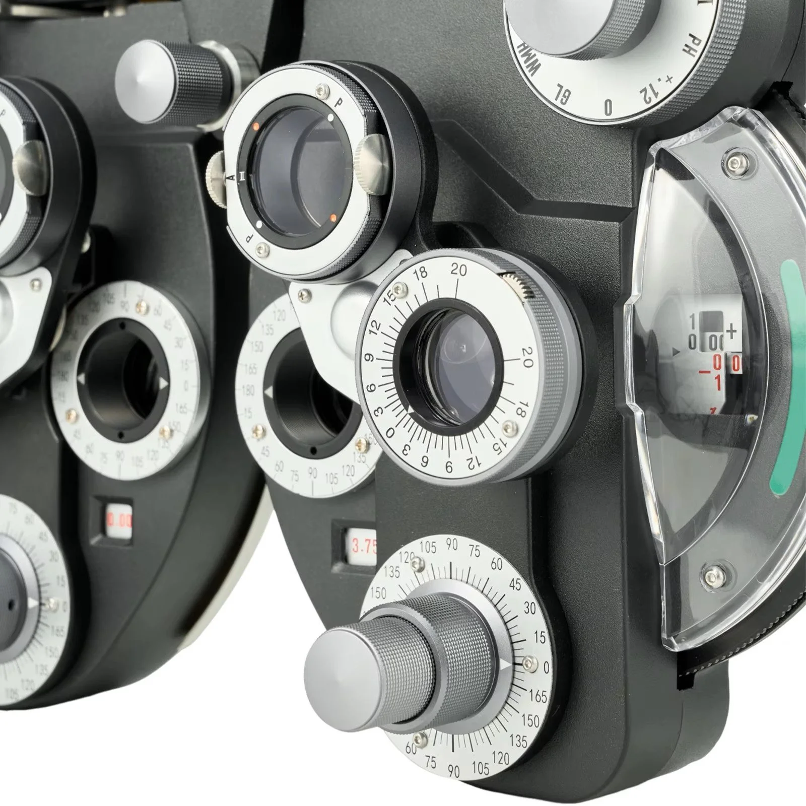 Close-up of an ophthalmic phoropter with various dials and lenses for eye examination.
