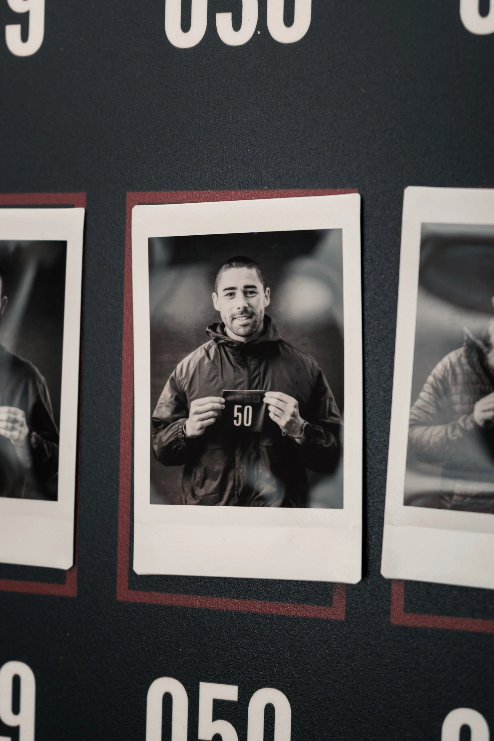 Polaroid-style black and white portrait of a runner displayed at the Torra Performance REDON Backyard Ultra