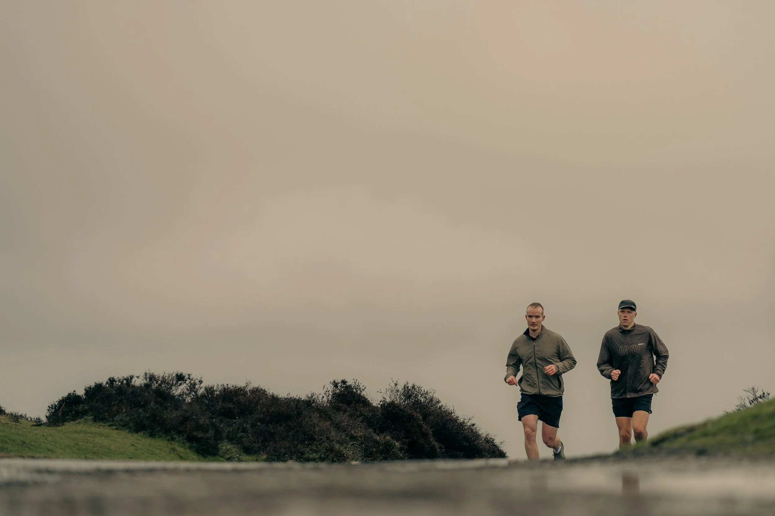 Runners heading away into the misty hills for the Torra Performance Long Mynd campaign