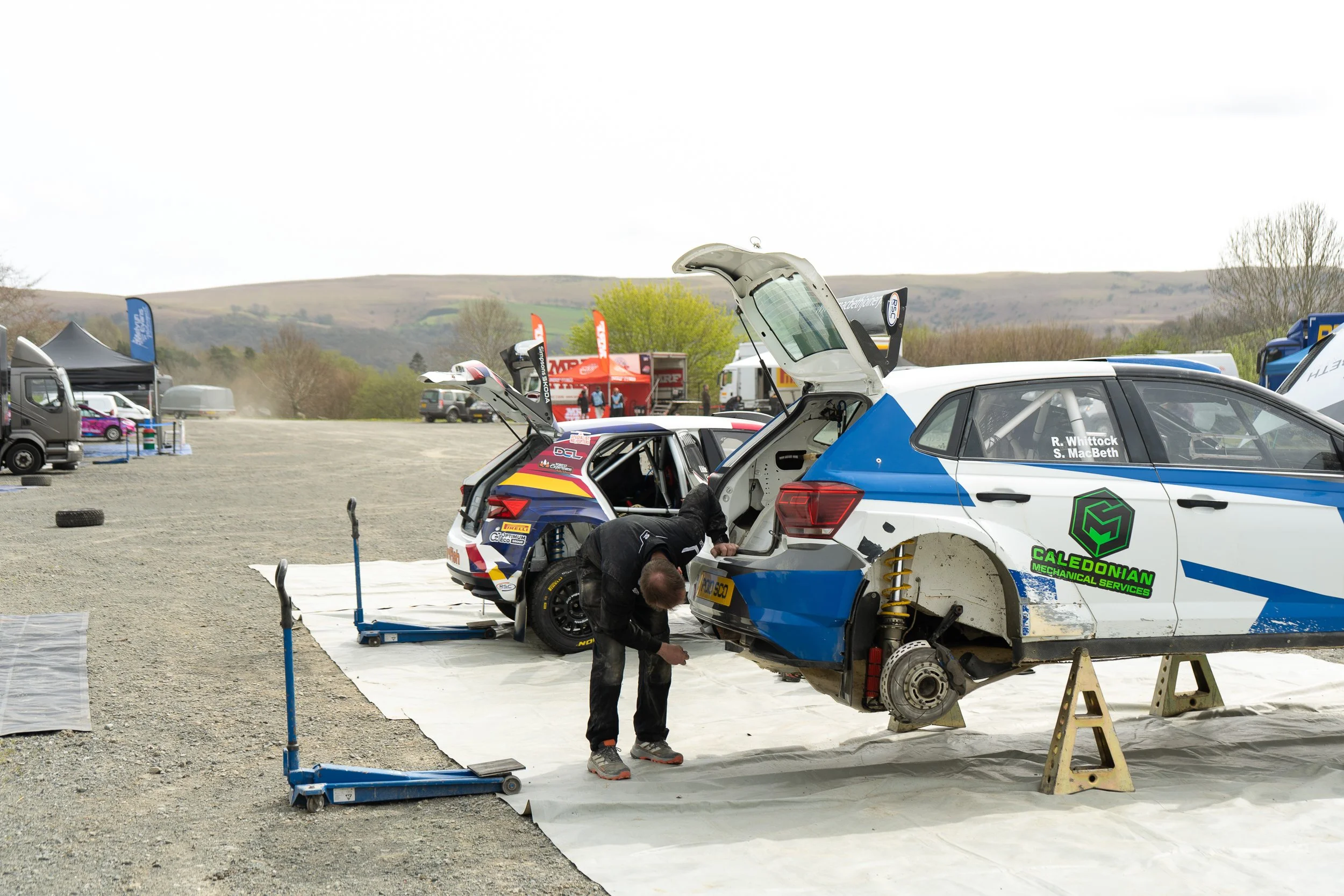Mechanic working on a rally car in the service park at the British Rally Championship Severn Valley Stages