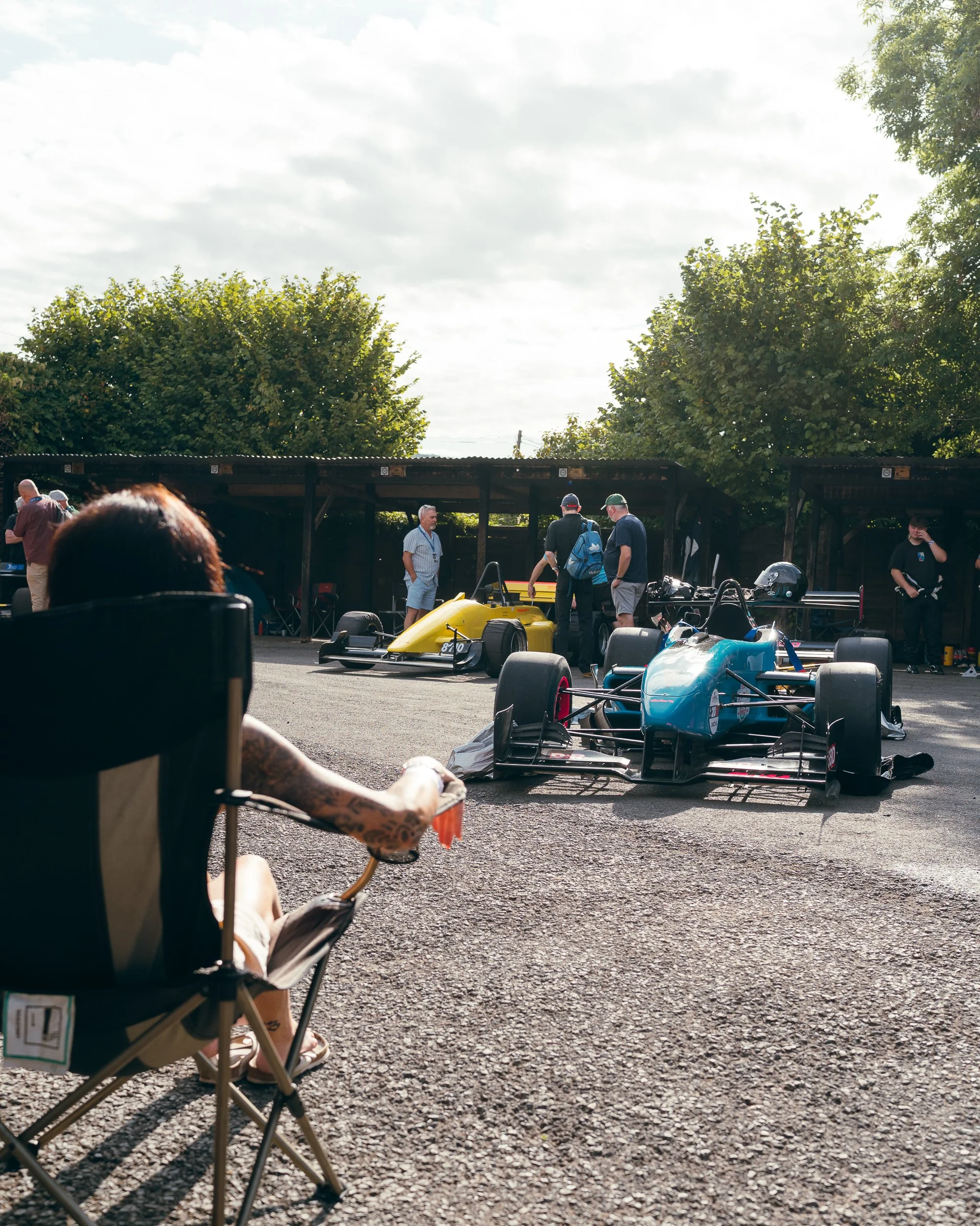 Spectator watching hill climb cars in the paddock at Shelsley Walsh Championship Challenge