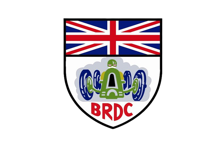 A shield-shaped emblem with the United Kingdom flag on top and an illustration of a robot with four wheels and a central body at the bottom, with the letters BRDC in red below the robot.