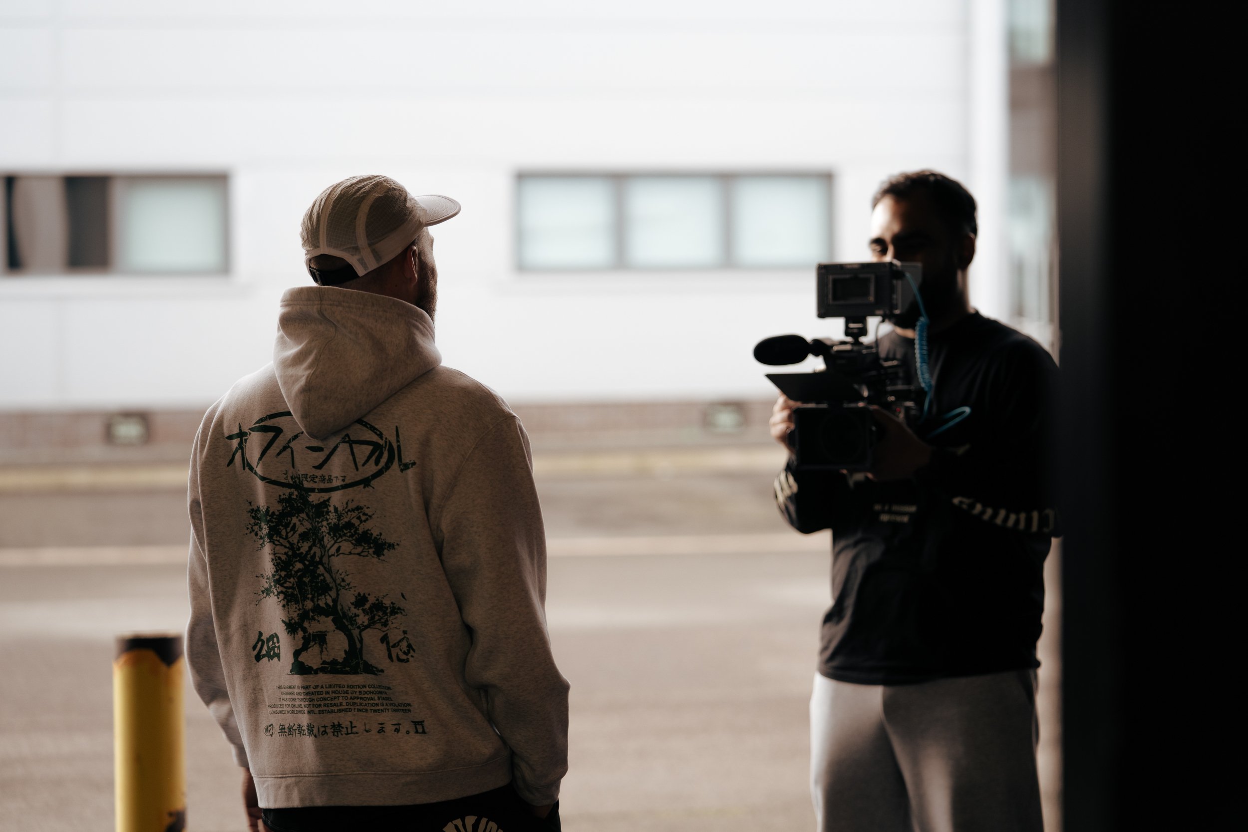 Crew member filming behind the scenes on set for the Torra Performance Engine Series campaign