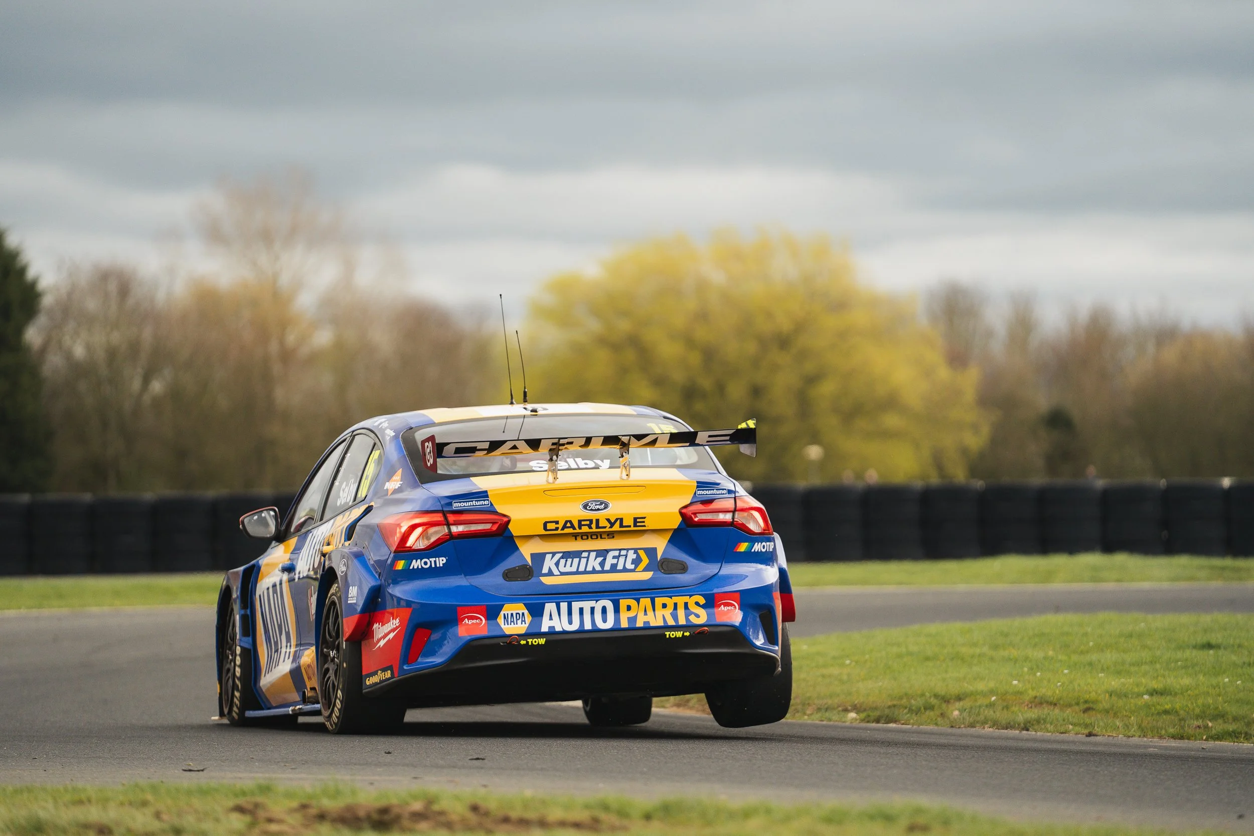 Blue and yellow Ford BTCC touring car on track during Croft testing