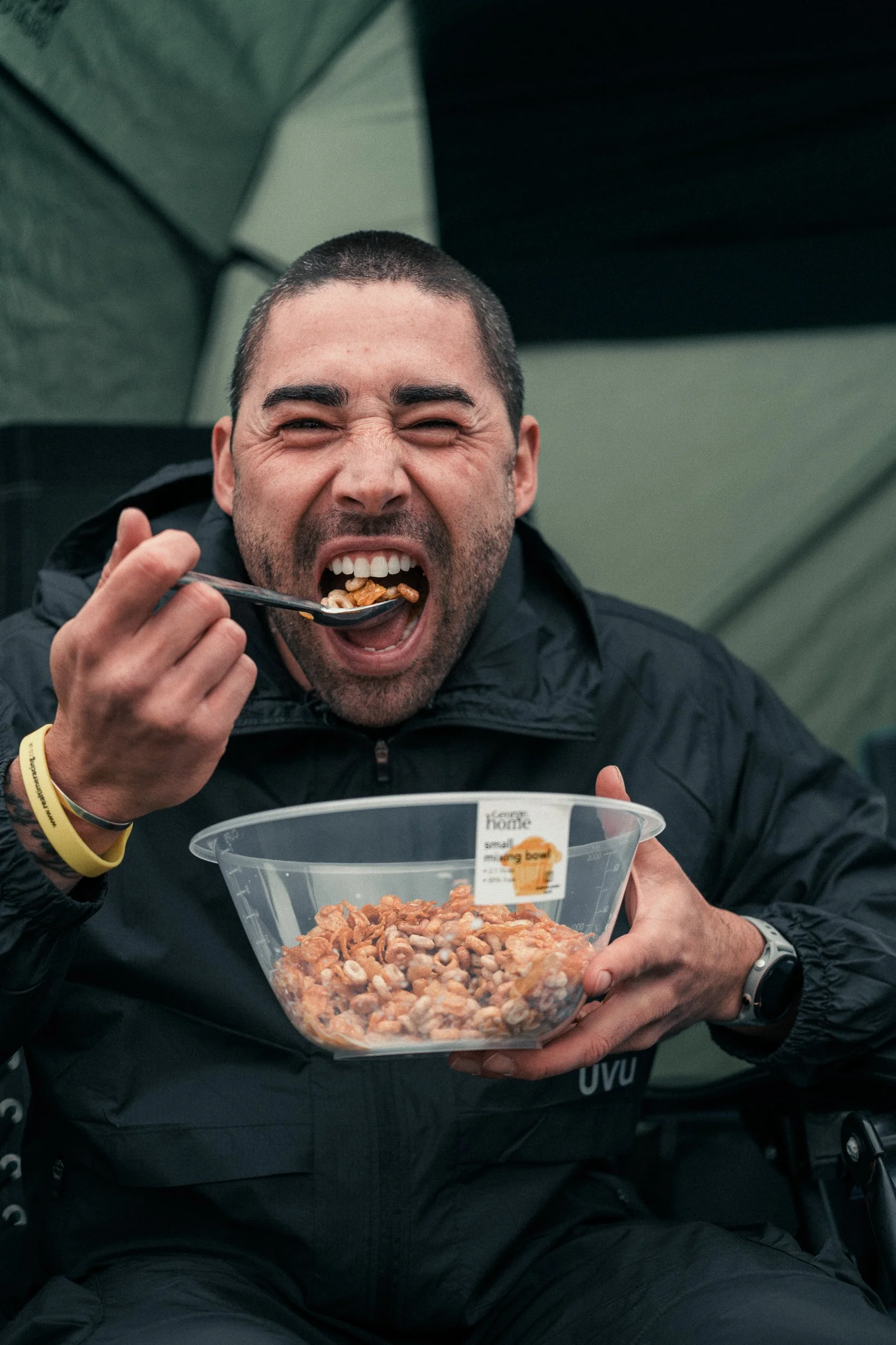 Runner refuelling with a bowl of food between laps at the Torra Performance REDON Backyard Ultra