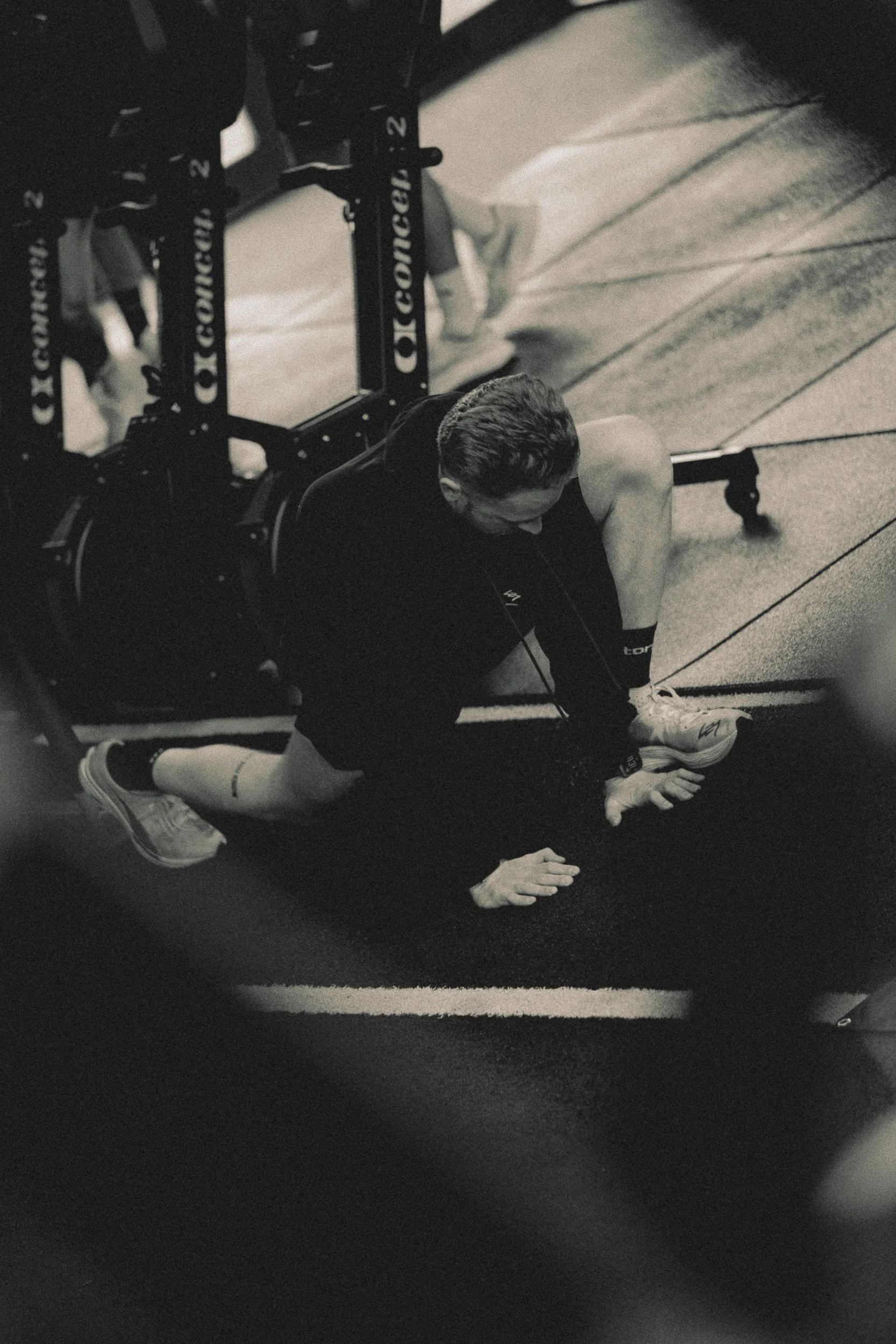 Overhead black and white shot of an athlete performing a floor exercise for the Torra Performance Engine Series campaign