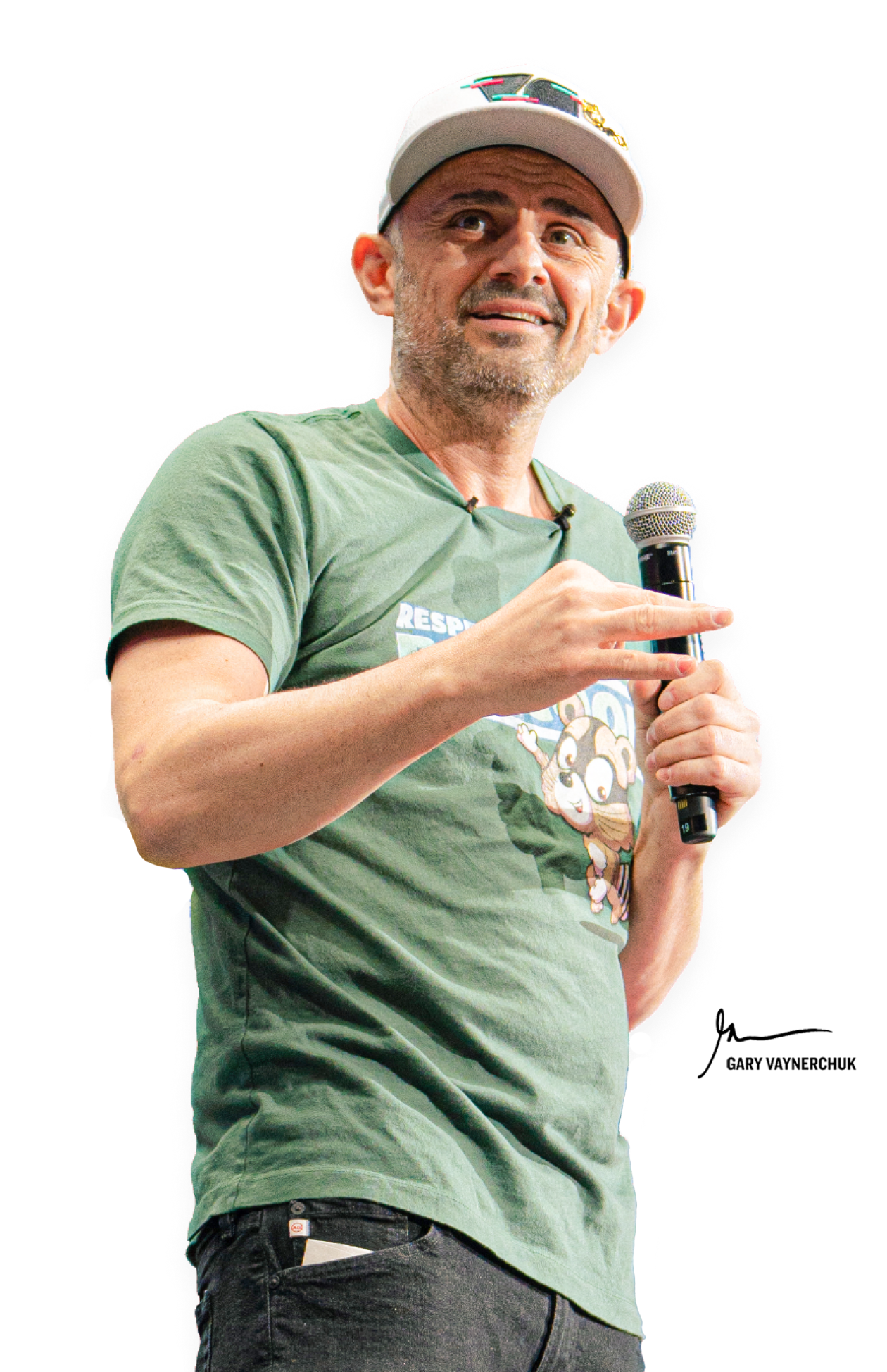 A man in a green t-shirt and baseball cap holding a microphone, giving a speech or presentation.