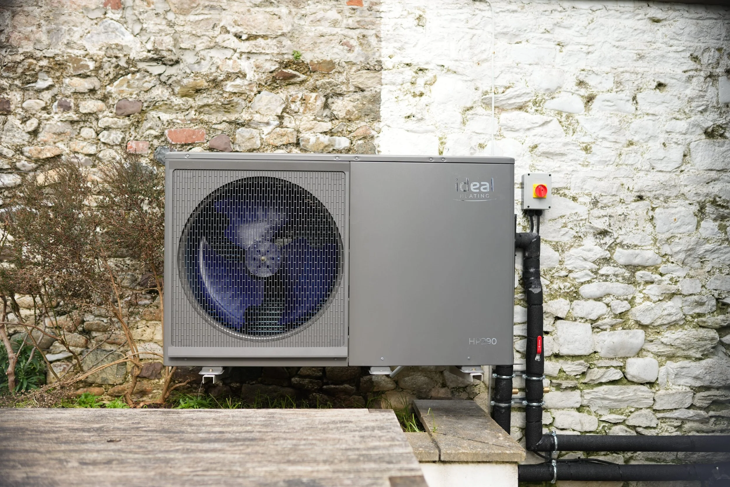 Air source heat pump installed outside a residential home in Plymouth, Devon.