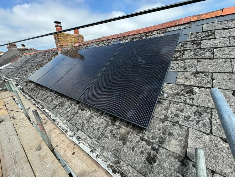A solar panel installation on a residential property, terraced housing located in Clifden, St Austell